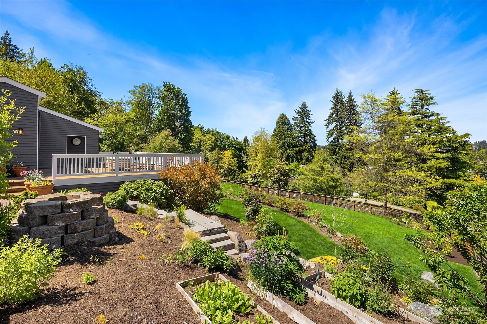 6024 Rose Loop Northeast Bainbridge Island, WA 98110 - Photo 27 of 40 a backyard of a house with a yard and outdoor seating