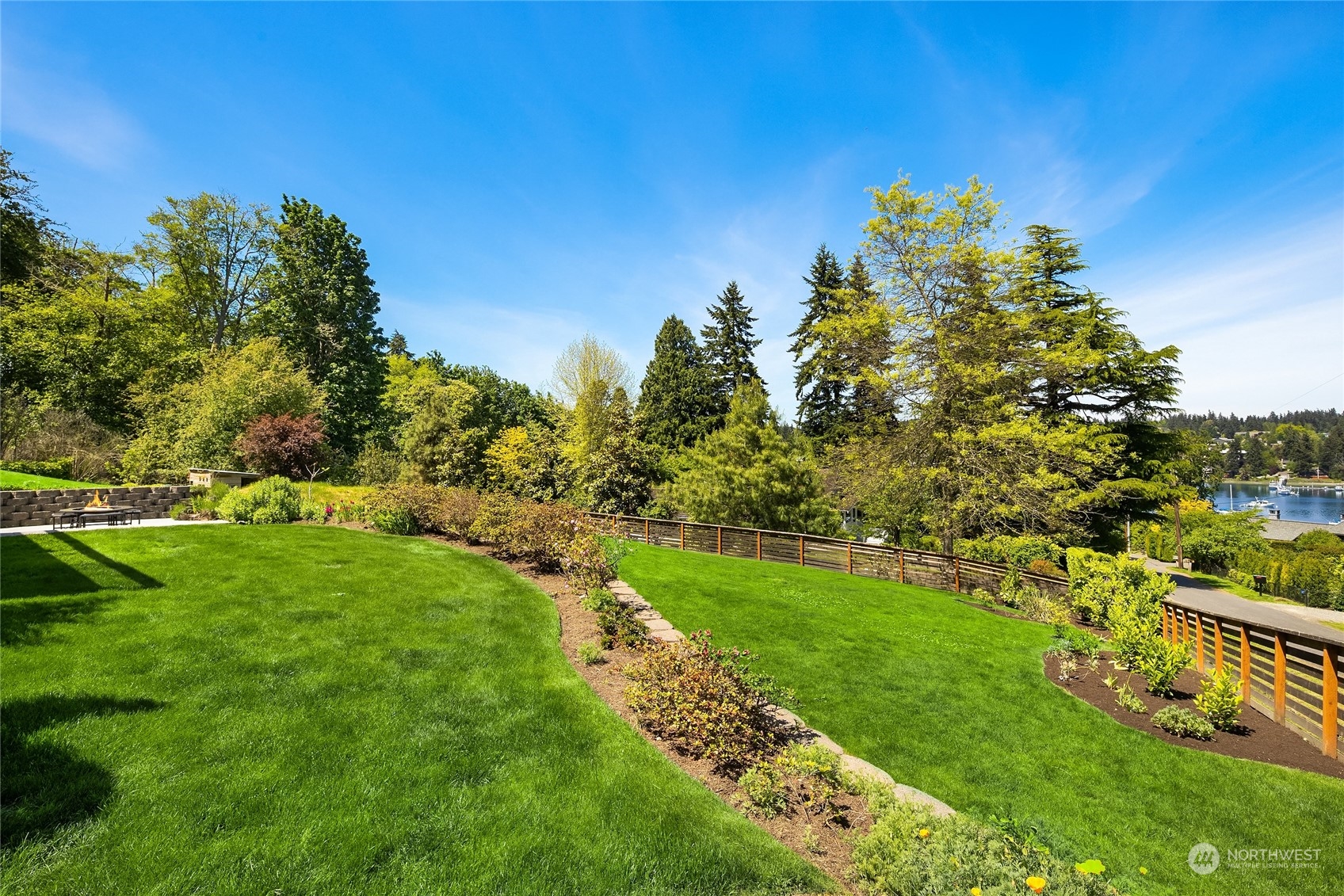 6024 Rose Loop Northeast Bainbridge Island, WA 98110 - Photo 29 of 40 a view of a large yard with a large tree