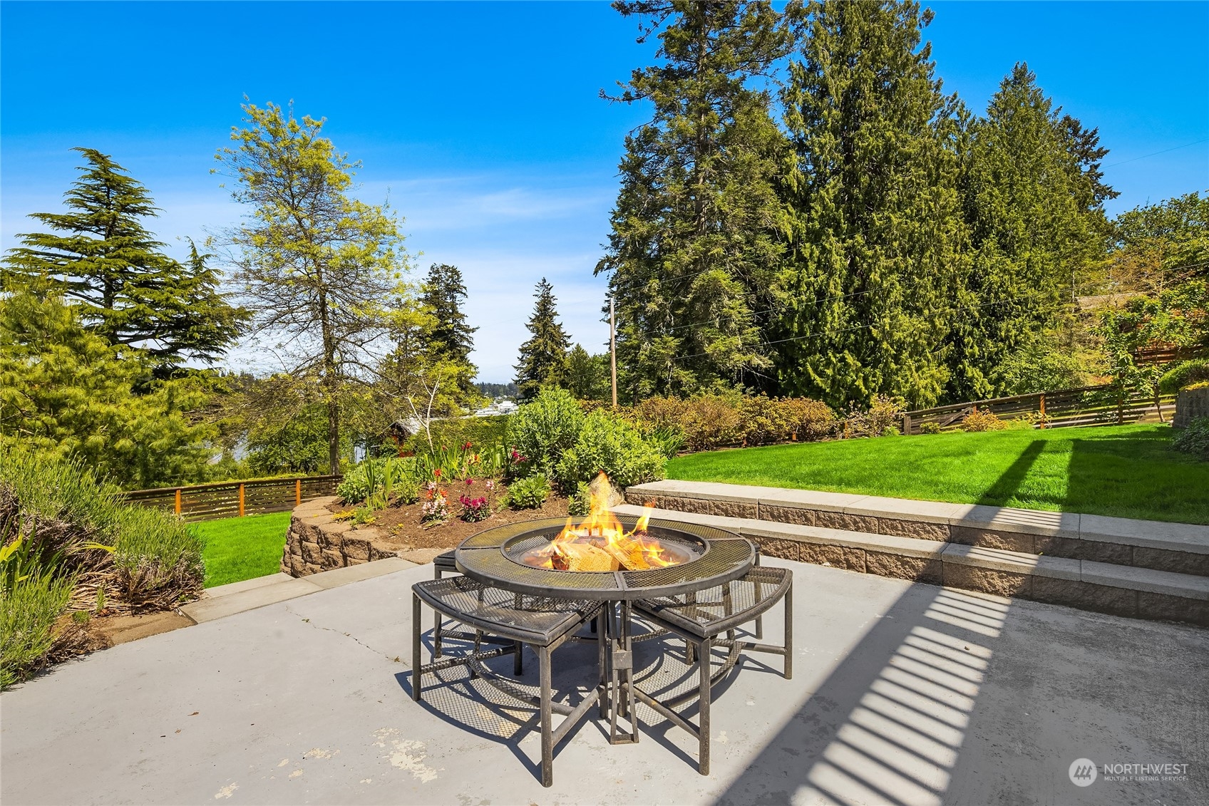 6024 Rose Loop Northeast Bainbridge Island, WA 98110 - Photo 31 of 40 a wooden bench sitting in a park with large trees