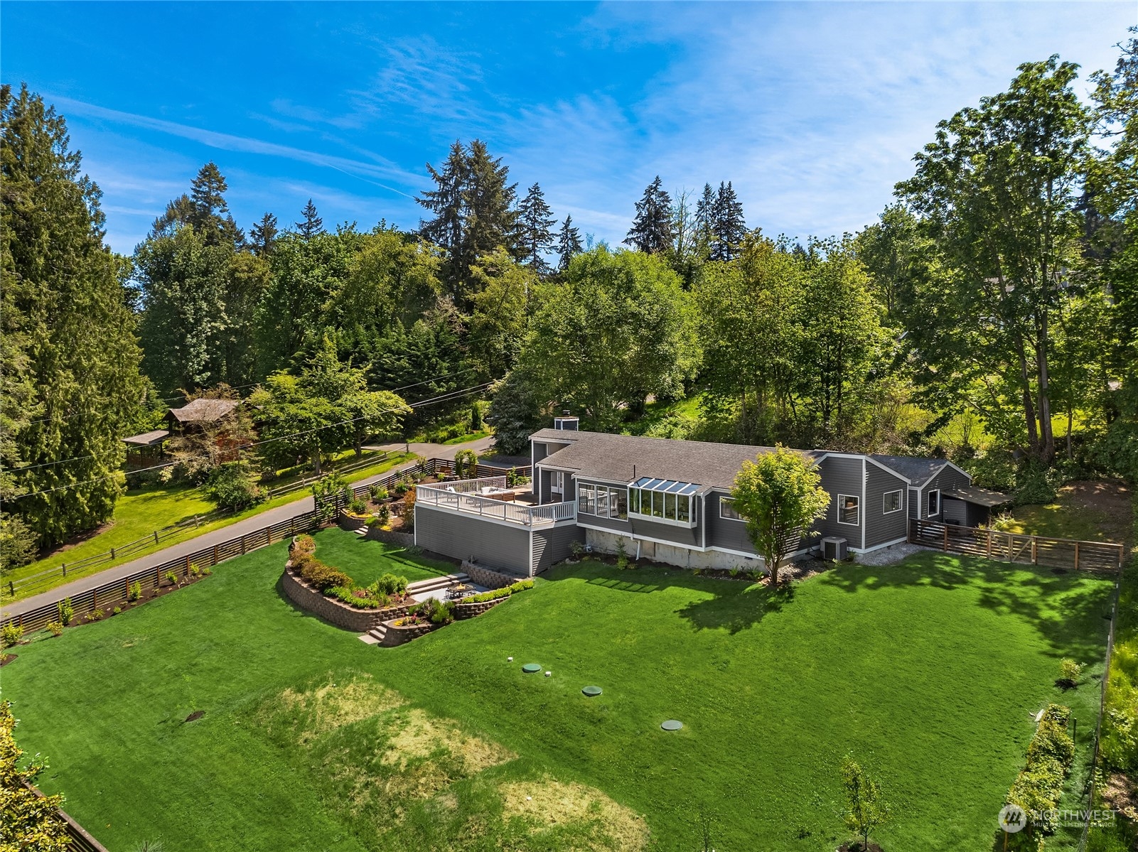 6024 Rose Loop Northeast Bainbridge Island, WA 98110 - Photo 34 of 40 a view of a house with backyard and sitting area