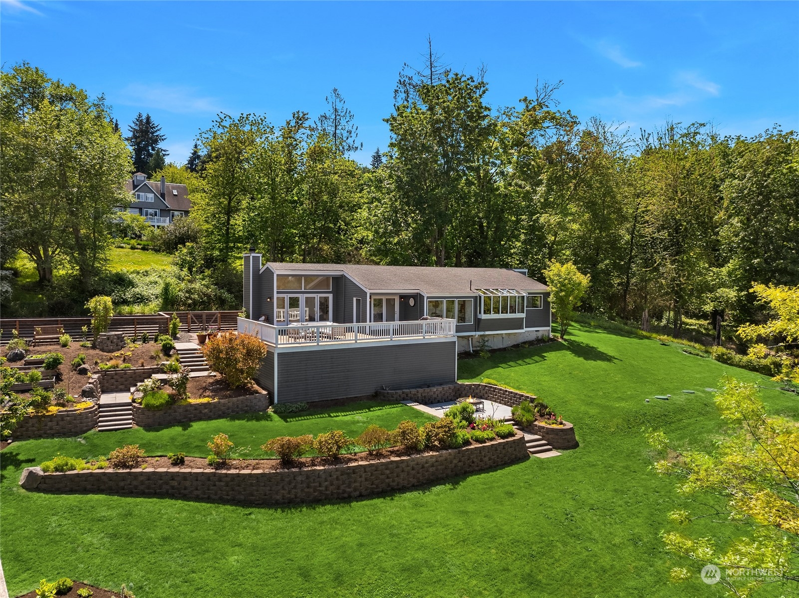6024 Rose Loop Northeast Bainbridge Island, WA 98110 - Photo 35 of 40 a front view of a house with a garden