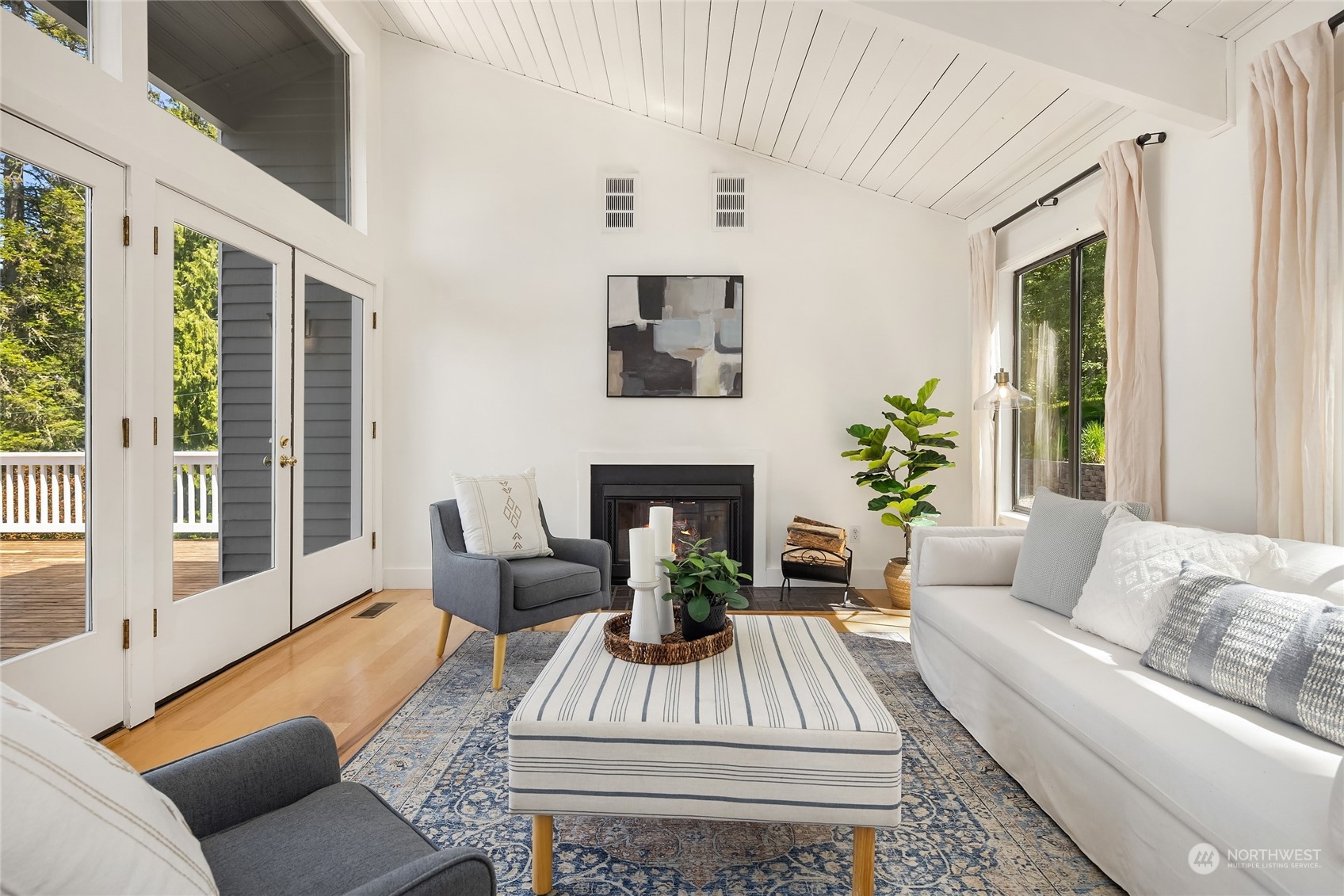 6024 Rose Loop Northeast Bainbridge Island, WA 98110 - Photo 4 of 40 a living room with furniture and a fireplace