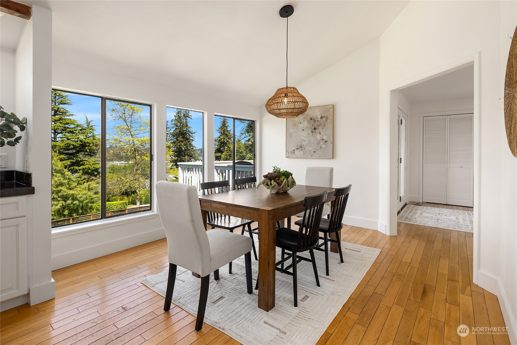 6024 Rose Loop Northeast Bainbridge Island, WA 98110 - Photo 5 of 40 a view of a dining room with furniture window and wooden floor