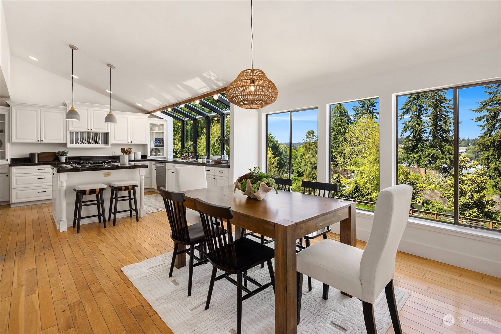 6024 Rose Loop Northeast Bainbridge Island, WA 98110 - Photo 7 of 40 a view of a dining room with furniture window and wooden floor