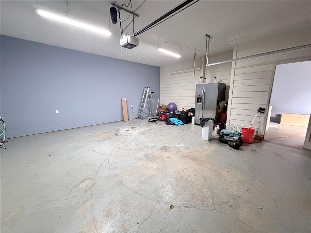 426 Pates Lake Court Hampton, GA 30228 - Photo 56 of 60 a view of a room with gym equipment and a large window