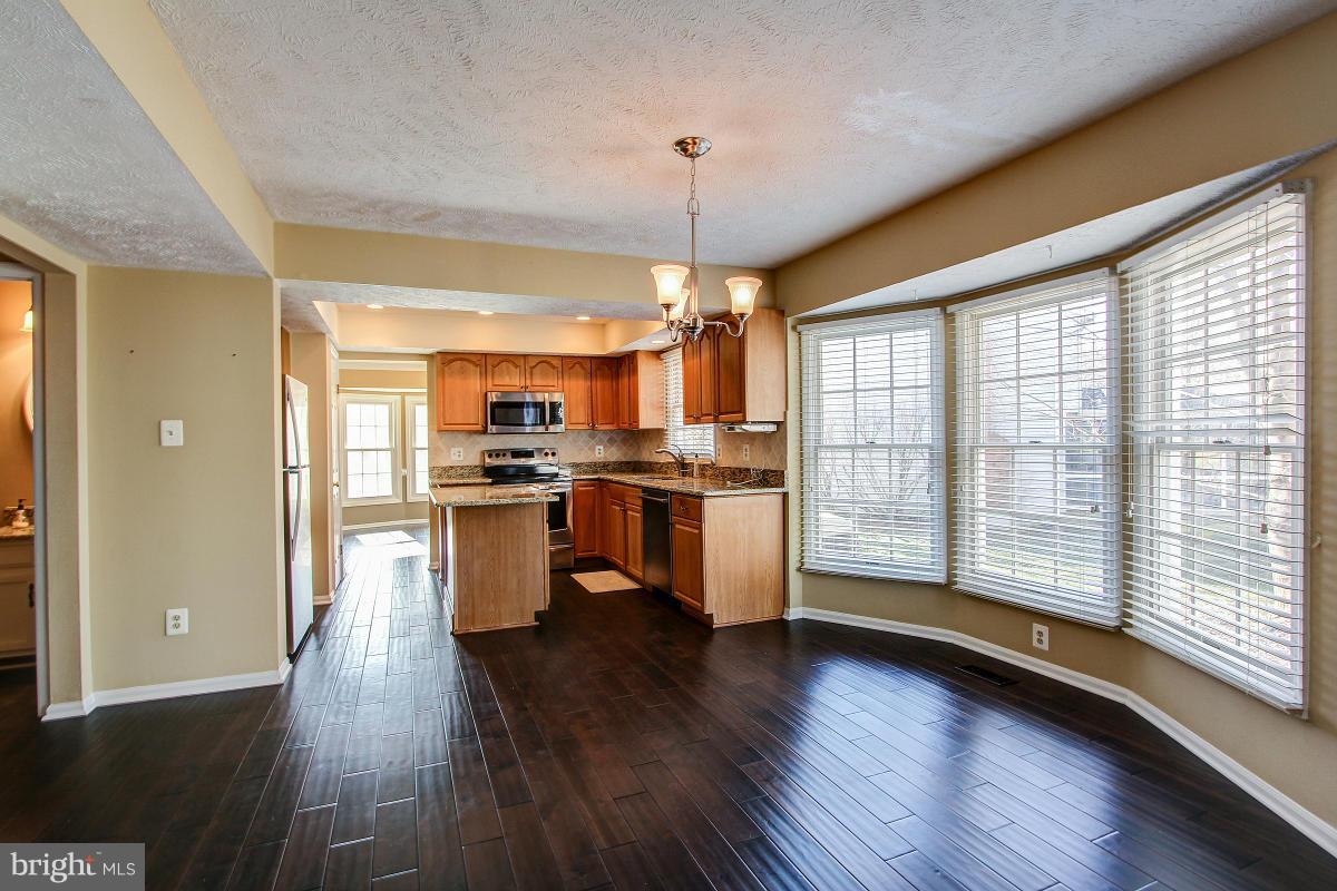 12501 Cross Country Lane Reston, VA 20191 - Photo 12 of 29 Family Room opens to Deck overlooking great yard