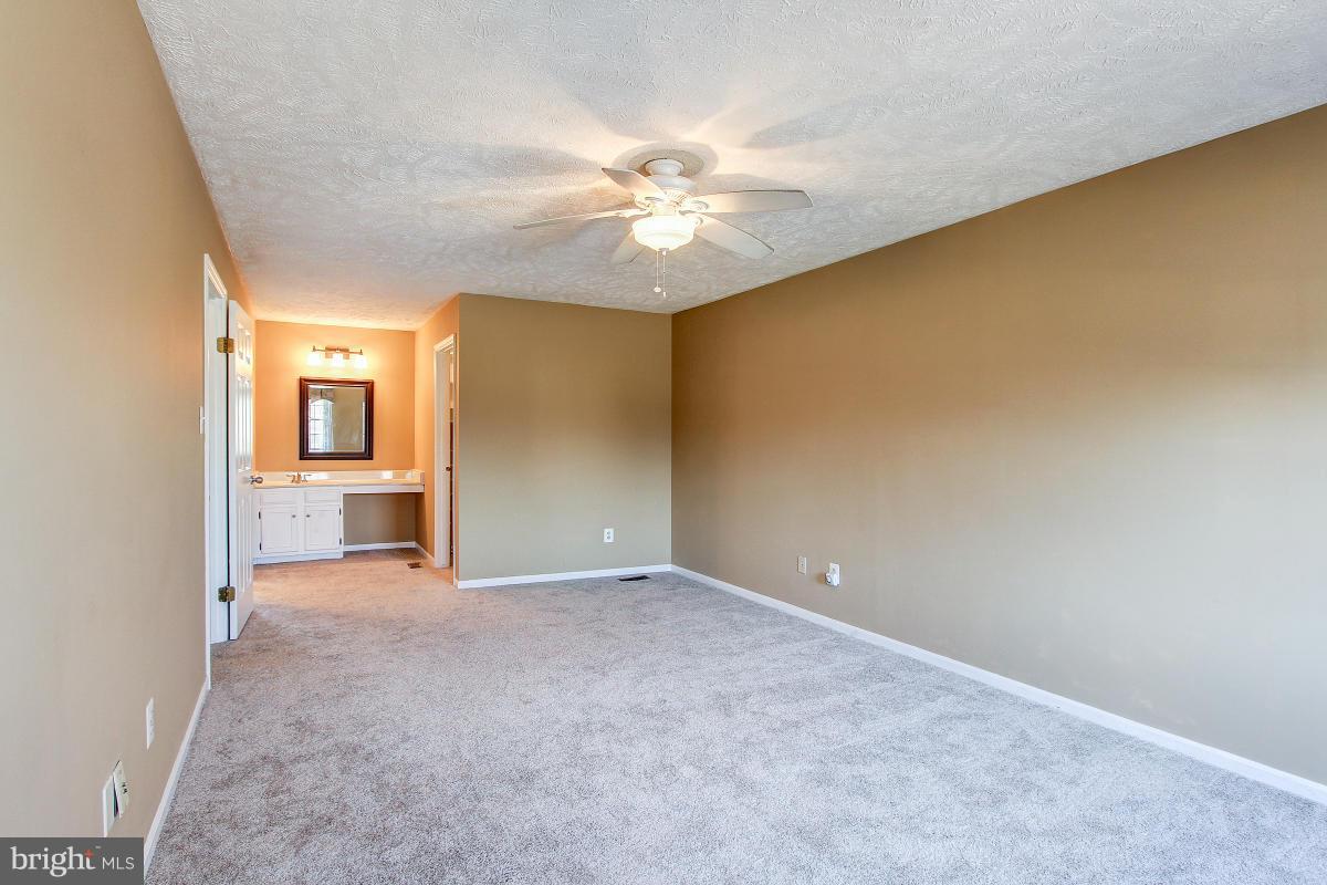 12501 Cross Country Lane Reston, VA 20191 - Photo 14 of 29 Lighted Ceiling Fan and Dressing Area enhance