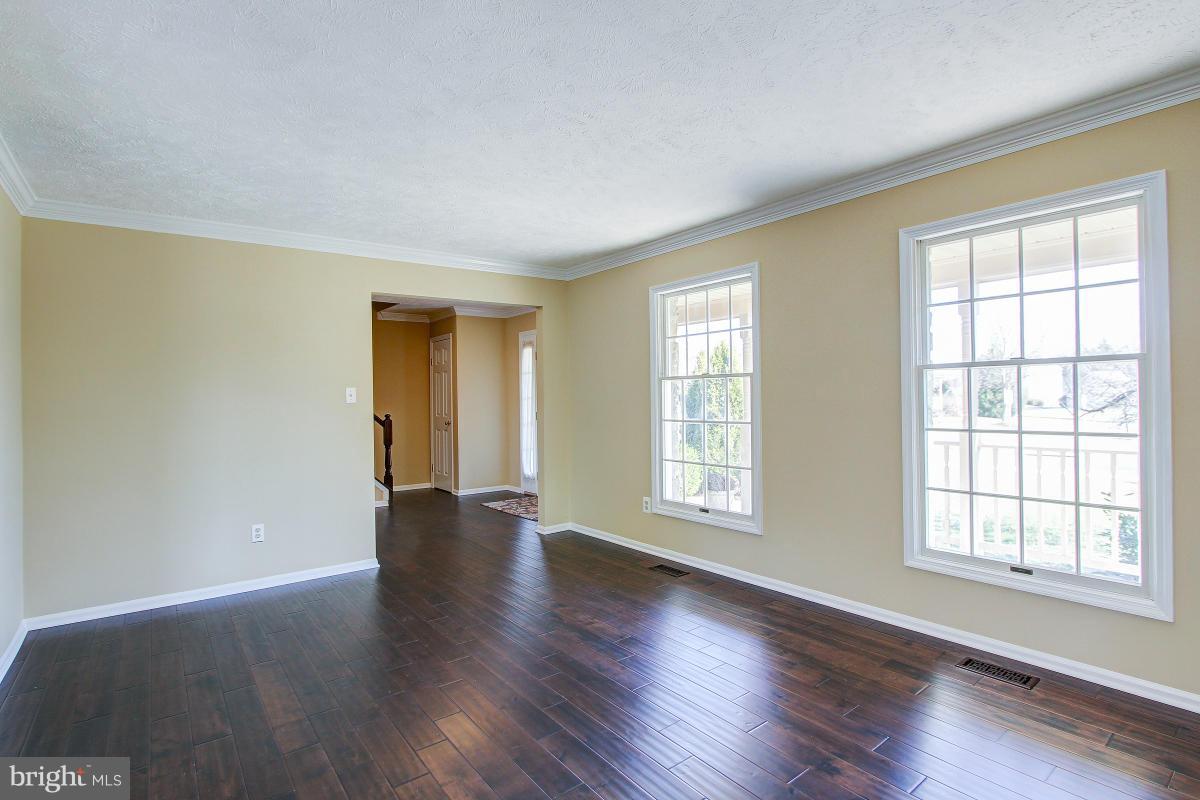 12501 Cross Country Lane Reston, VA 20191 - Photo 4 of 29 Bright Living Room with gorgeous mahogany floors