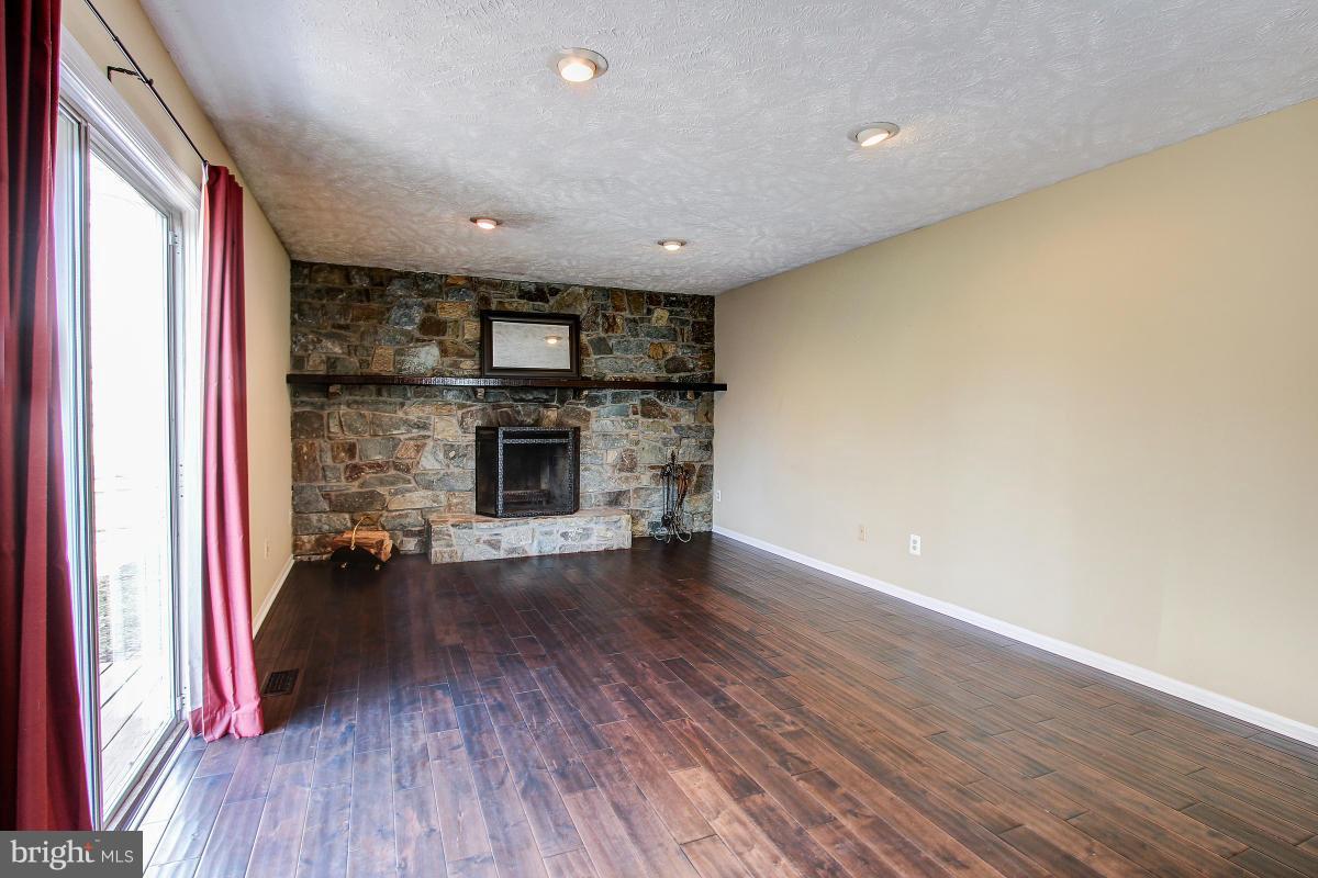 12501 Cross Country Lane Reston, VA 20191 - Photo 10 of 29 Stunning Stone Wall and Fireplace