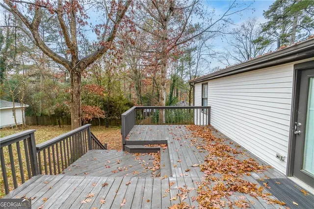 a view of a house with a yard covered in snow