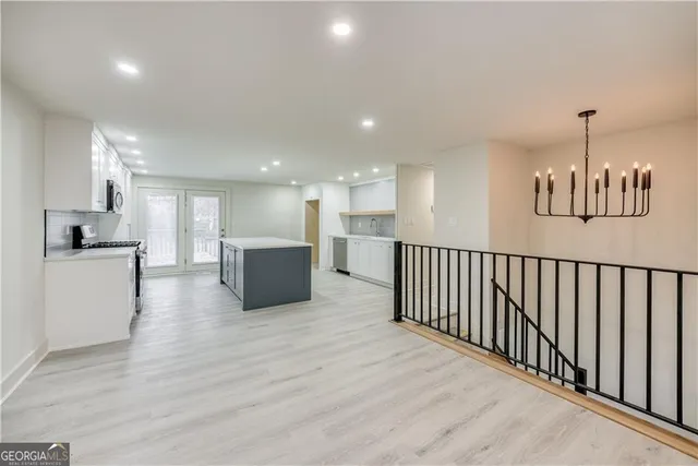 a view of a kitchen with a sink and an oven
