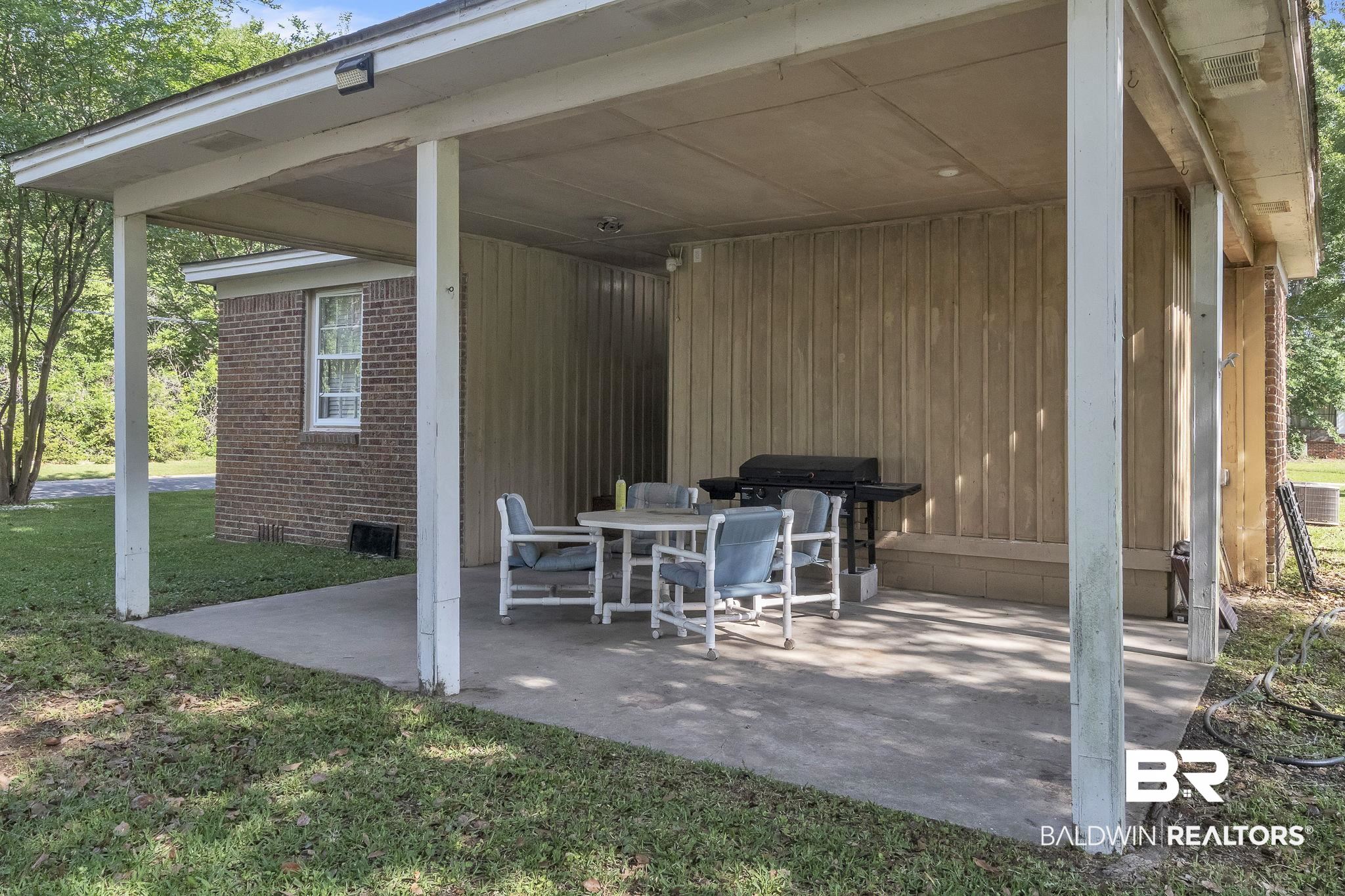 315 Fourth Avenue Chickasaw, AL 36611 - Photo 14 of 28 View of patio / terrace featuring a carport and a grill
