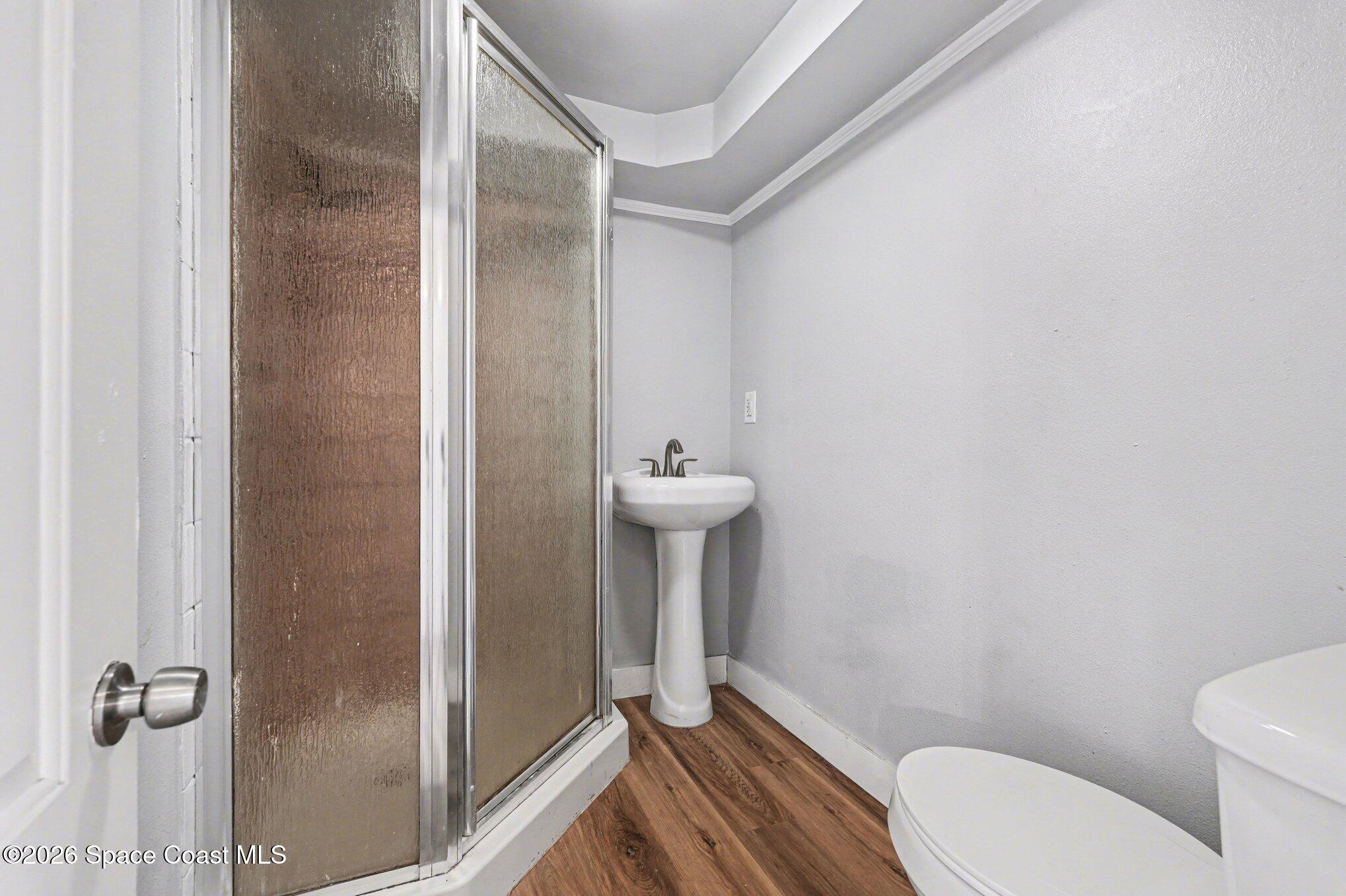 4950 Blounts Ridge Road Mims, FL 32754 - Photo 17 of 40 a bathroom with a sink a toilet and shower