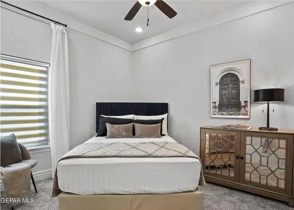 a bedroom with a bed and window