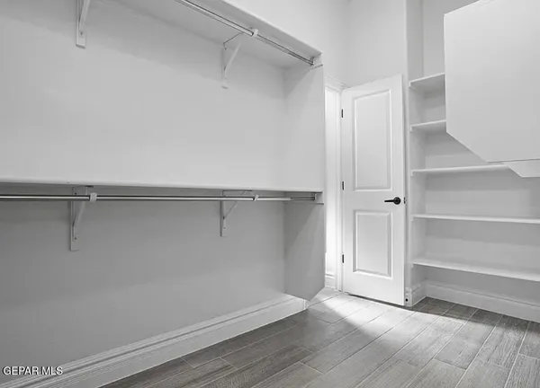 a view of an empty walk in closet