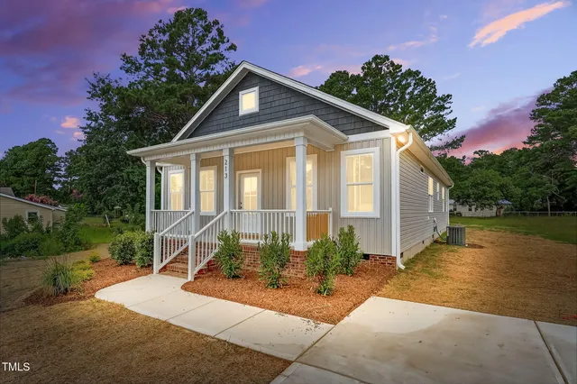 a front view of a house with garden