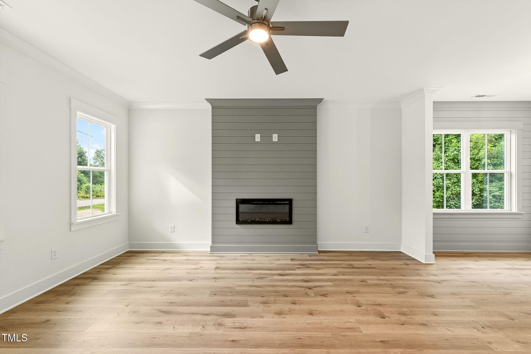 213 Maye Street Dunn, NC 28334 - Photo 11 of 45 a view of a livingroom with a fireplace and window