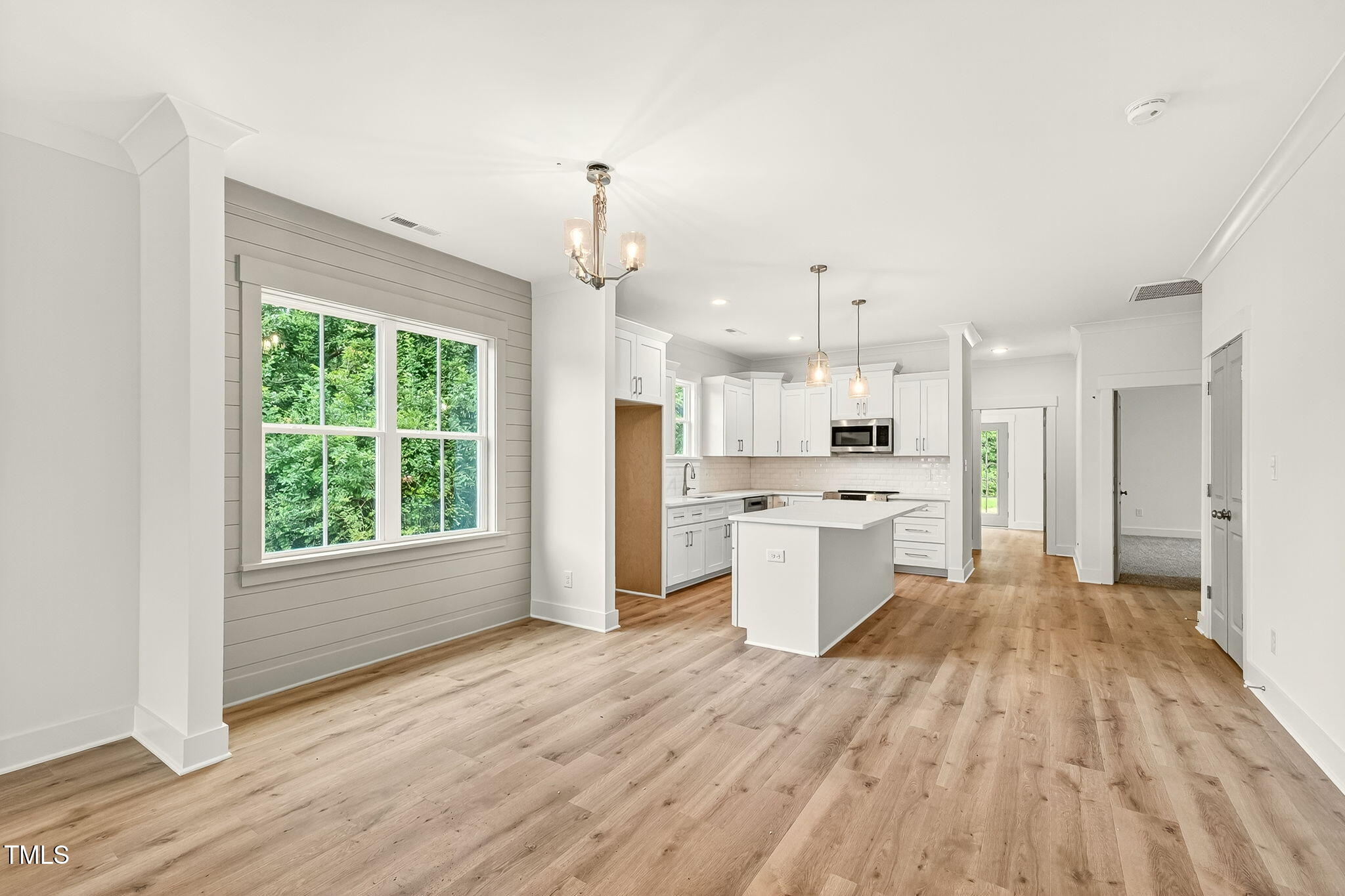 213 Maye Street Dunn, NC 28334 - Photo 15 of 45 a large kitchen with a lot of counter space and wooden floor