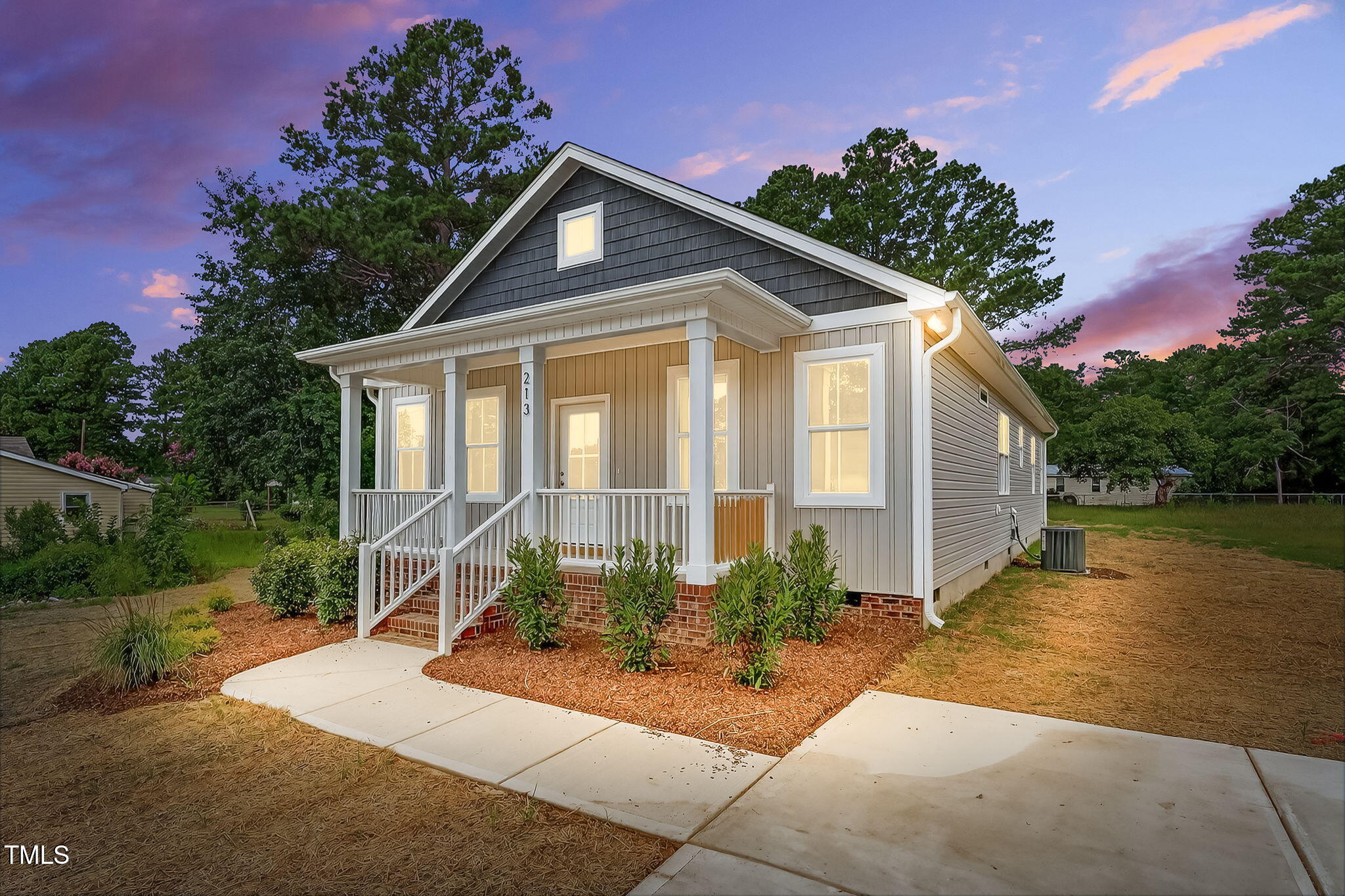 213 Maye Street Dunn, NC 28334 - Photo 2 of 45 a front view of a house with garden