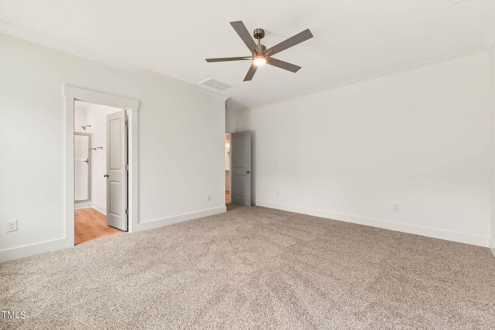 213 Maye Street Dunn, NC 28334 - Photo 23 of 45 an empty room with ceiling fan and window
