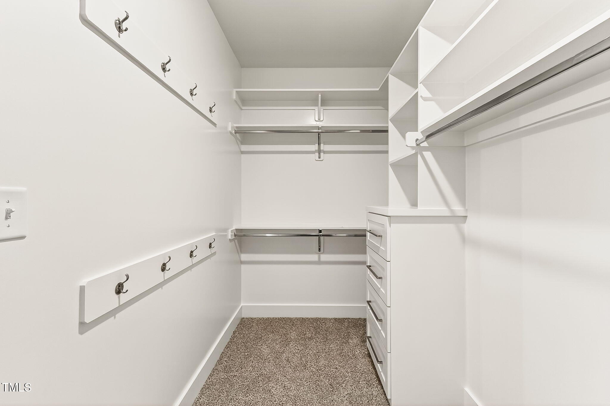 213 Maye Street Dunn, NC 28334 - Photo 28 of 45 a view of walk in closet with empty racks