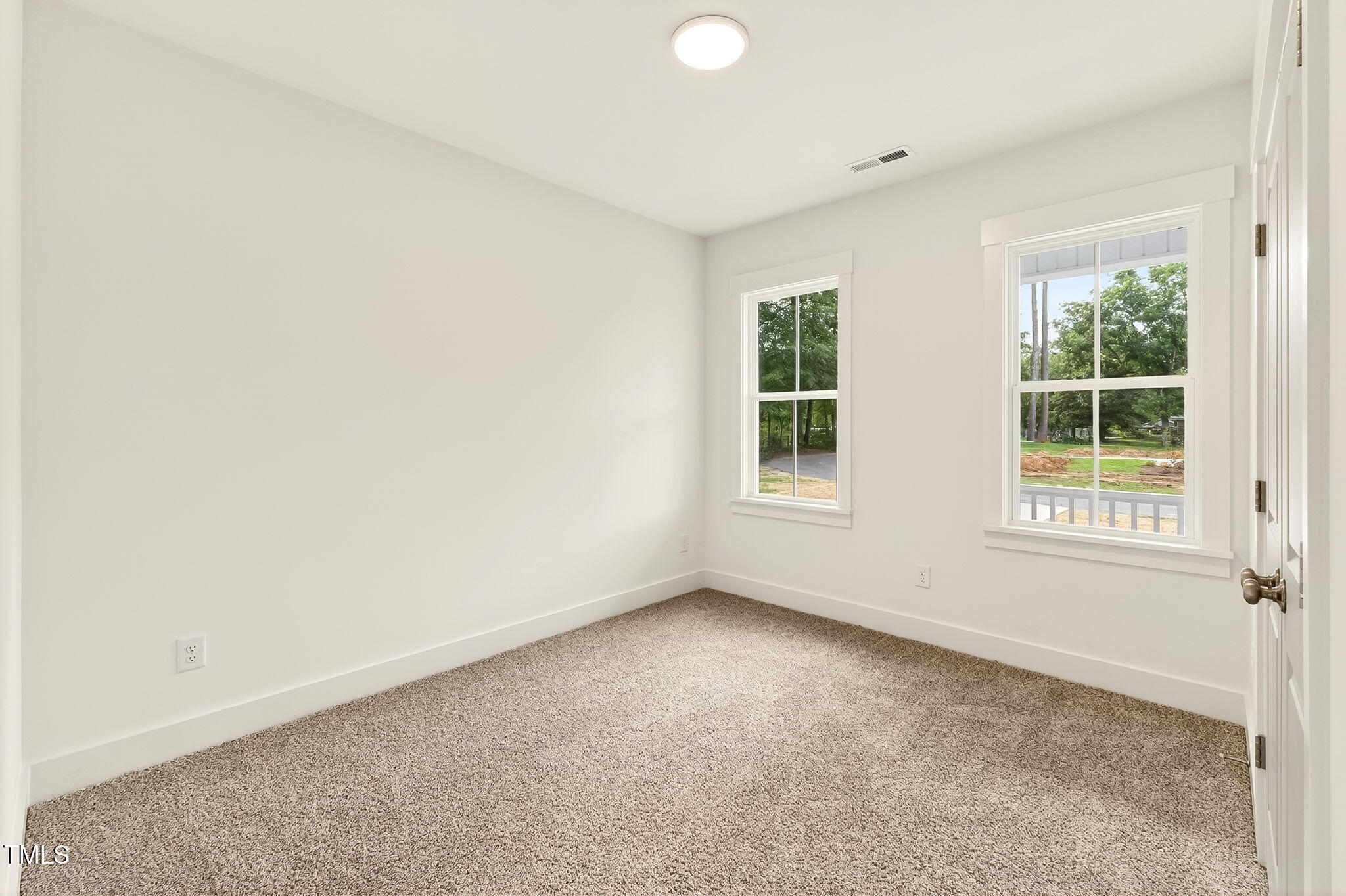 213 Maye Street Dunn, NC 28334 - Photo 31 of 45 an empty room with windows