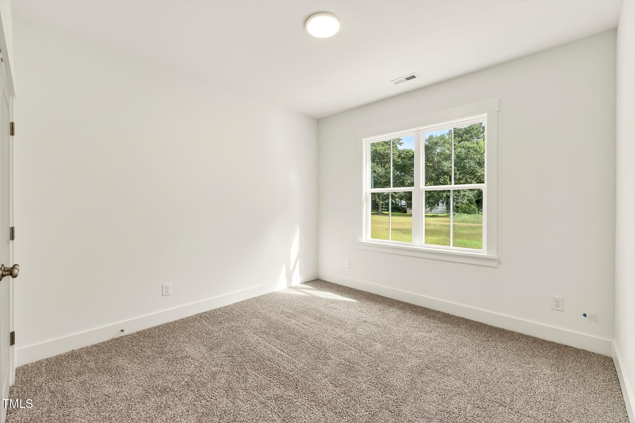 213 Maye Street Dunn, NC 28334 - Photo 34 of 45 an empty room with a window