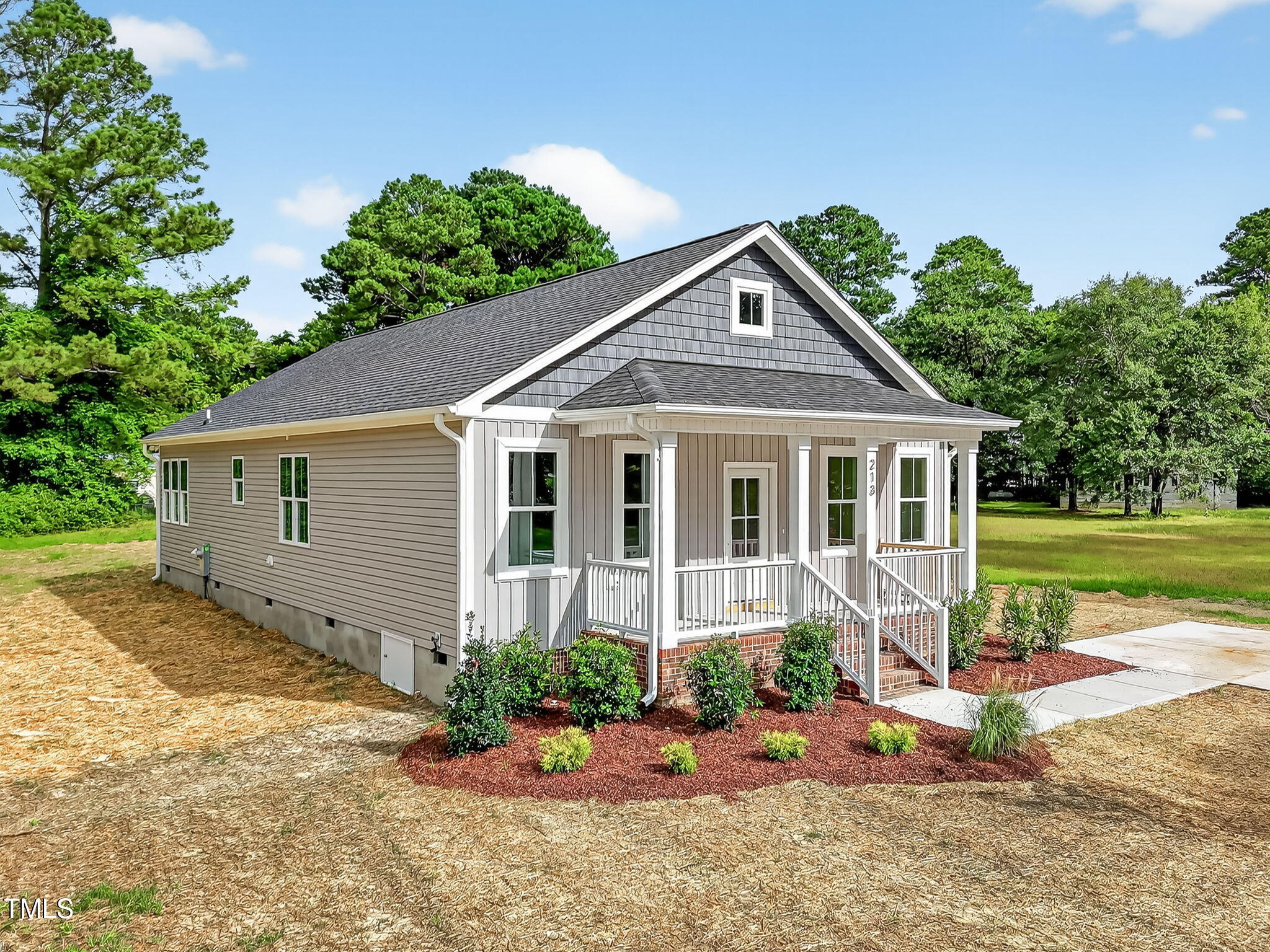 213 Maye Street Dunn, NC 28334 - Photo 4 of 45 a front view of a house with a yard