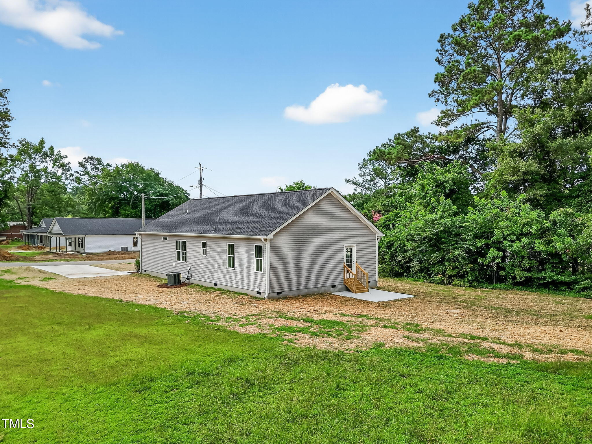 213 Maye Street Dunn, NC 28334 - Photo 42 of 45 a view of a house with a yard