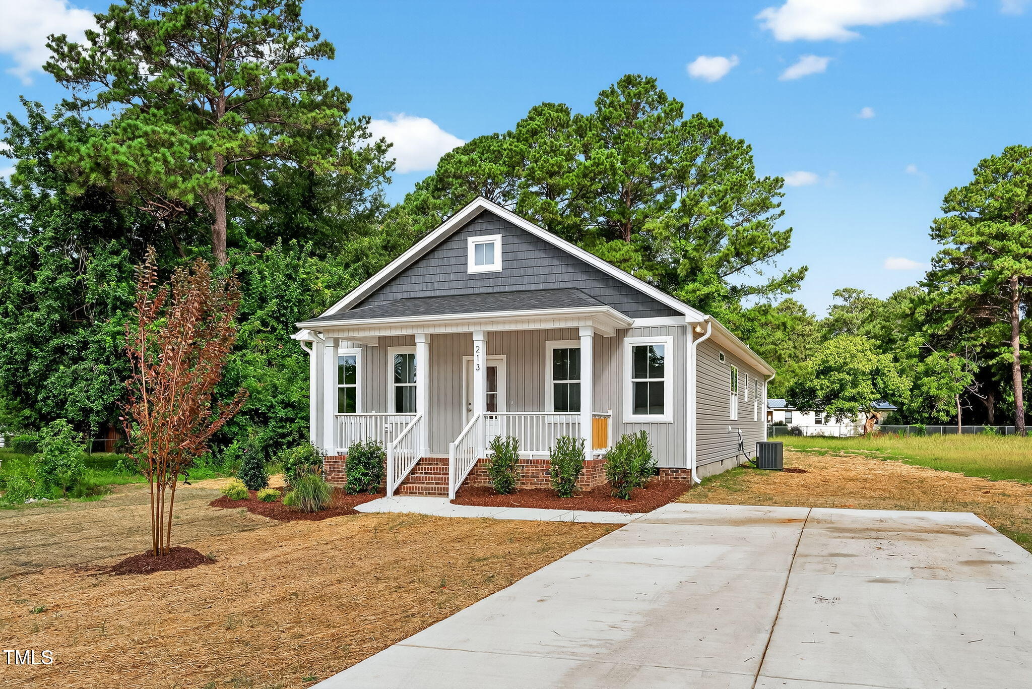 213 Maye Street Dunn, NC 28334 - Photo 5 of 45 a front view of a house with a yard