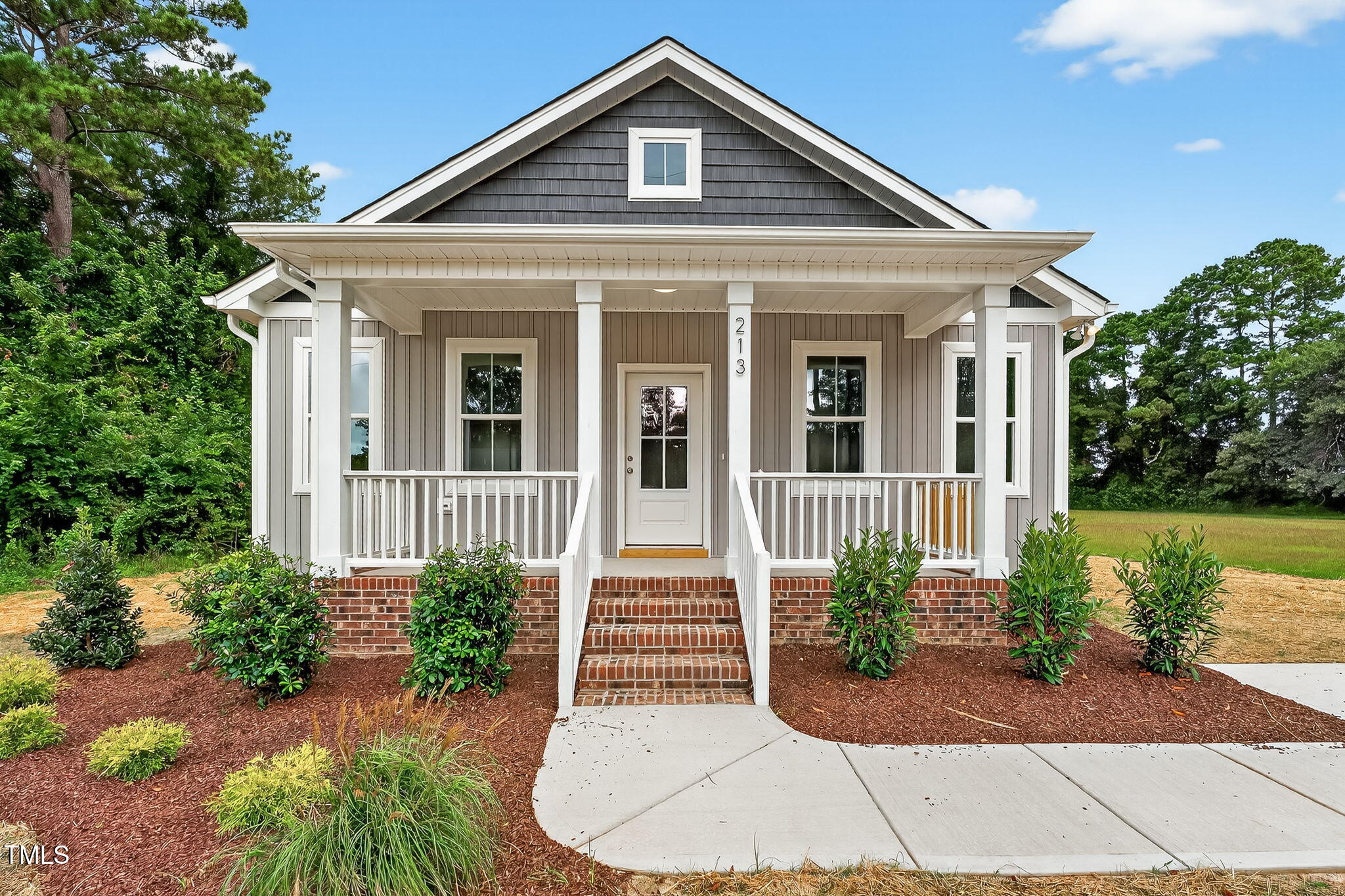 213 Maye Street Dunn, NC 28334 - Photo 7 of 45 a front view of a house with garden