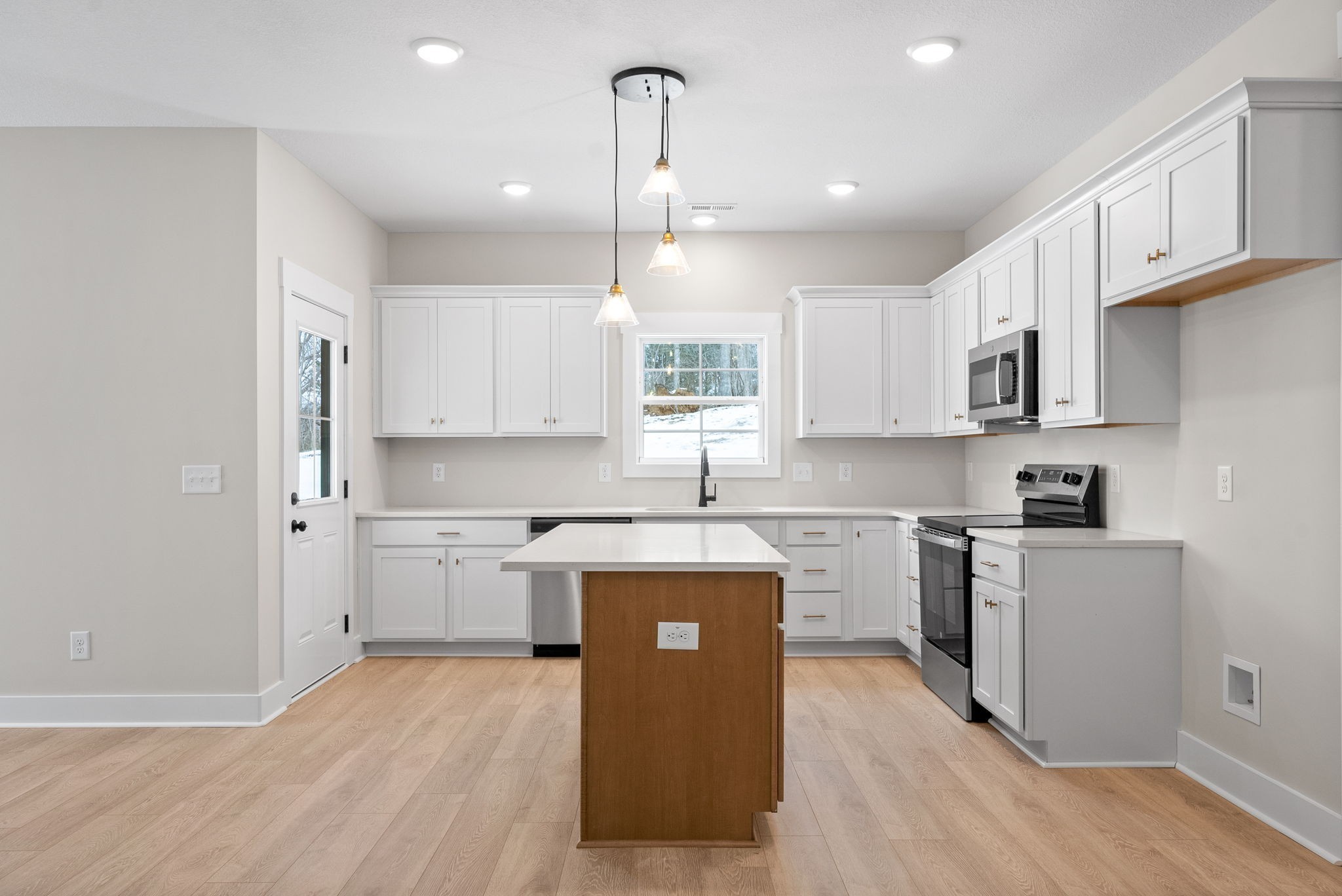 217 Wayne Hall Road Clarksville, TN 37040 - Photo 12 of 36 a kitchen with stainless steel appliances granite countertop a sink stove and refrigerator