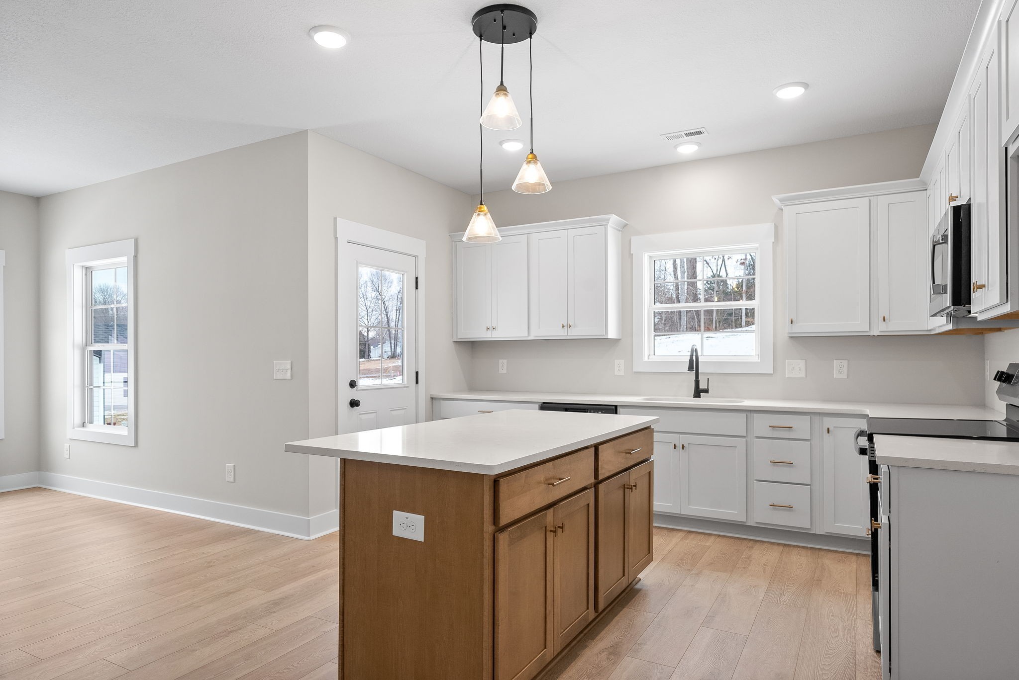 217 Wayne Hall Road Clarksville, TN 37040 - Photo 13 of 36 a kitchen with white cabinets appliances and a window