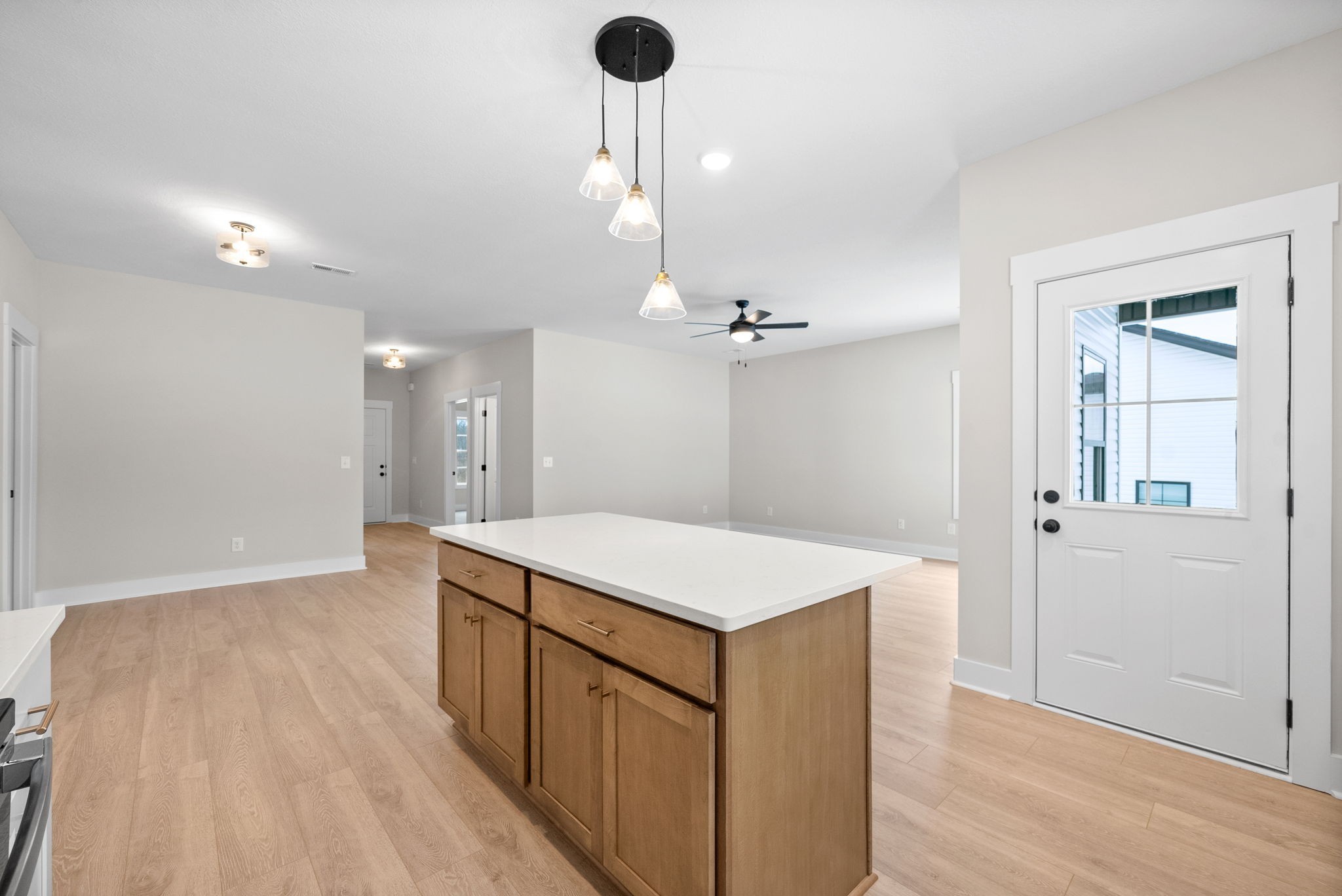 217 Wayne Hall Road Clarksville, TN 37040 - Photo 16 of 36 a view of a kitchen island a sink a refrigerator and wooden floor