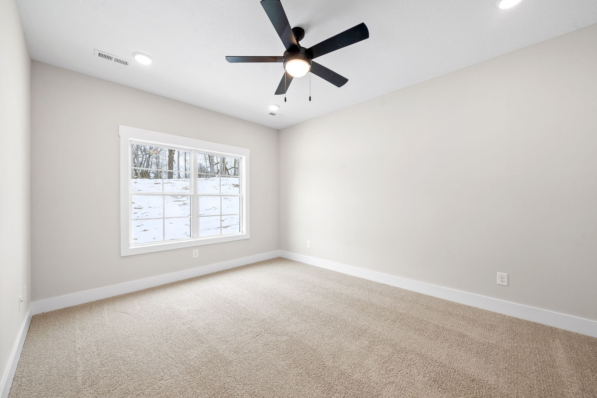 217 Wayne Hall Road Clarksville, TN 37040 - Photo 20 of 36 an empty room with a window and a fan