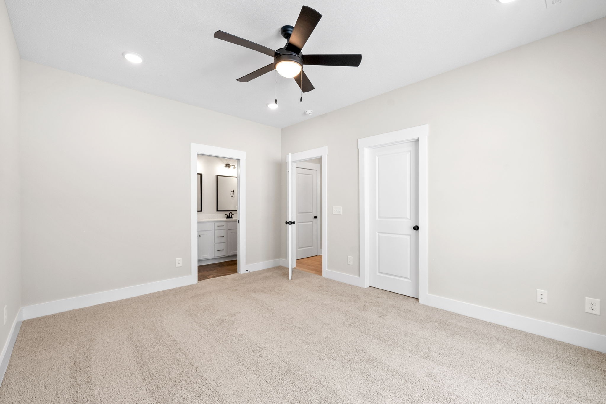217 Wayne Hall Road Clarksville, TN 37040 - Photo 21 of 36 wooden floor in an empty room and a ceiling fan