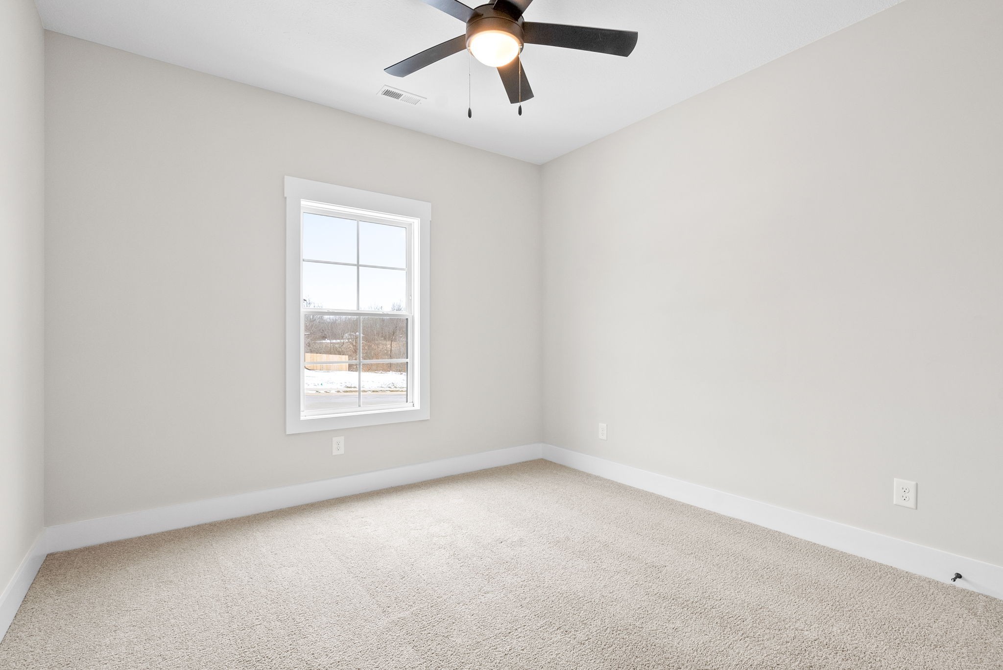 217 Wayne Hall Road Clarksville, TN 37040 - Photo 26 of 36 an empty room with a window and a fan