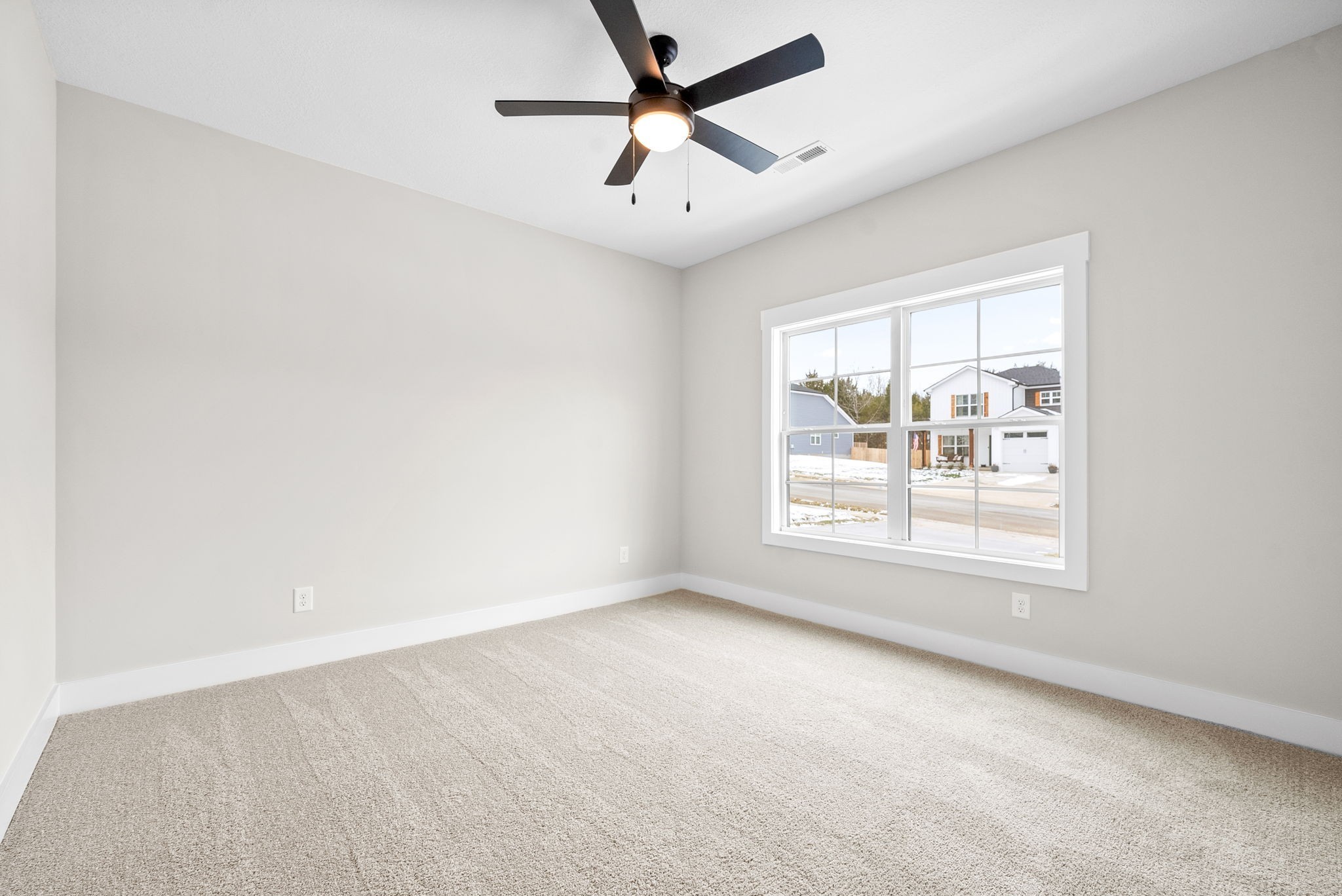 217 Wayne Hall Road Clarksville, TN 37040 - Photo 30 of 36 an empty room with a window and a ceiling fan