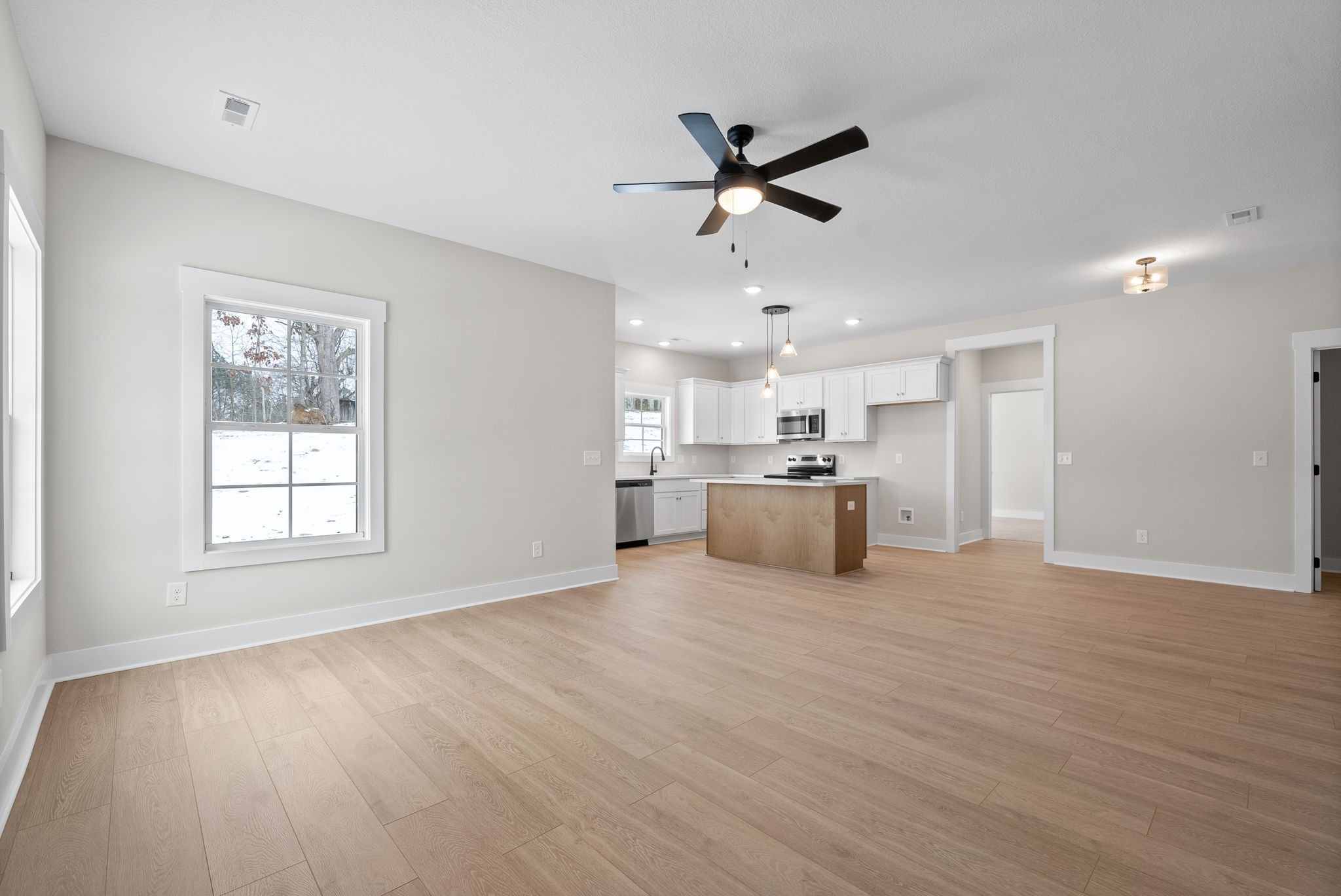 217 Wayne Hall Road Clarksville, TN 37040 - Photo 9 of 36 a view of a kitchen with a sink wooden cabinet and a window