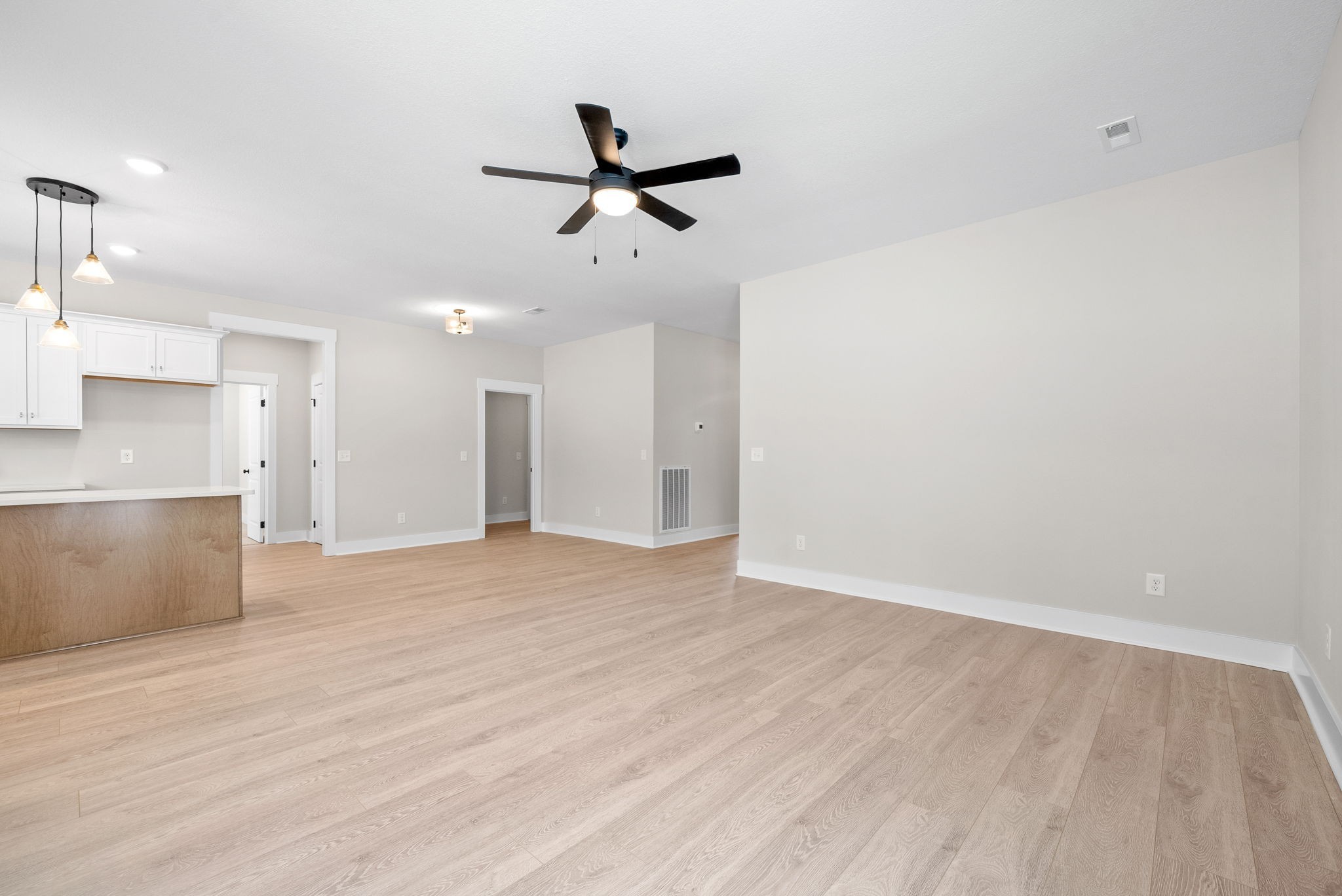217 Wayne Hall Road Clarksville, TN 37040 - Photo 10 of 36 a view of empty room with wooden floor and window