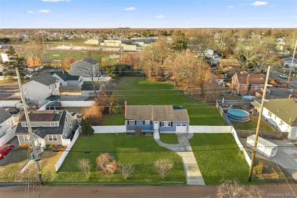 an aerial view of a house with a ocean view
