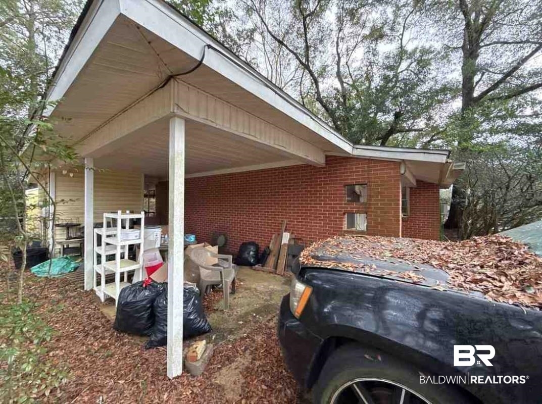 4117 Rebecca Road Mobile, AL 36609 - Photo 2 of 6 View of home's exterior featuring brick siding