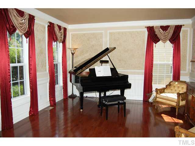 9219 Stone Mountain Road Raleigh, NC 27613 - Photo 4 of 25 To the left of the foyer is the formal living room wrapped with crown and wainscoting with rope trim details. Living Room