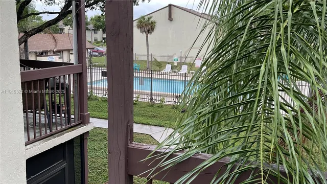 a view of a balcony with a tree