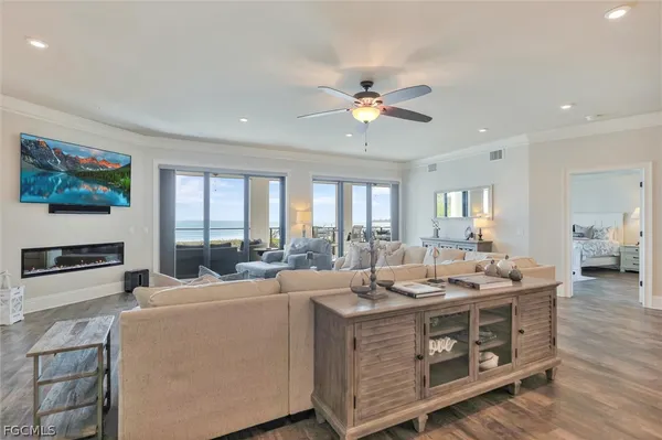 a view of living room with granite countertop furniture and a fireplace