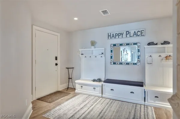 a view of kitchen with furniture and wooden floor