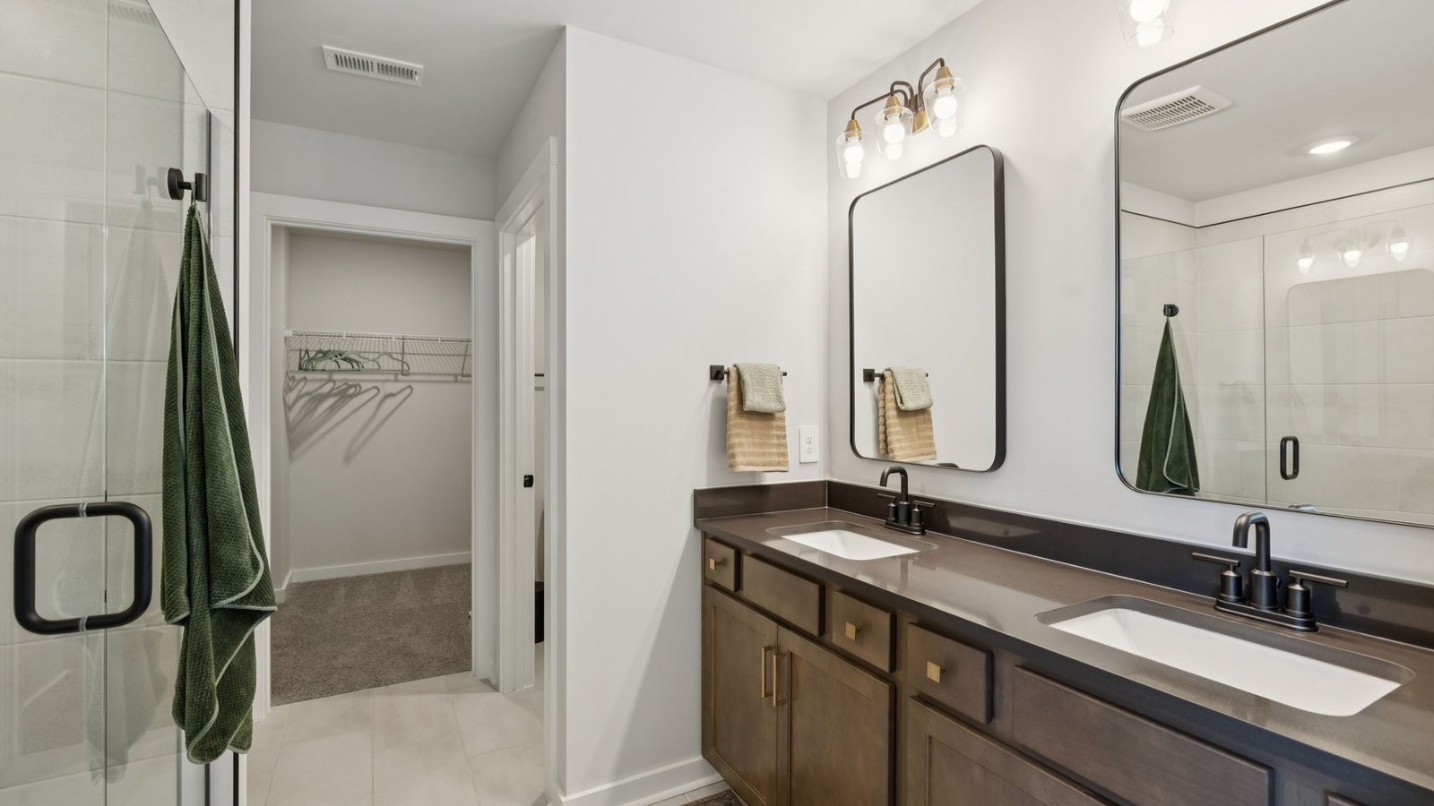 305 Harvest Point Boulevard Spring Hill, TN 37174 - Photo 36 of 48 a bathroom with a double vanity sink and a mirror