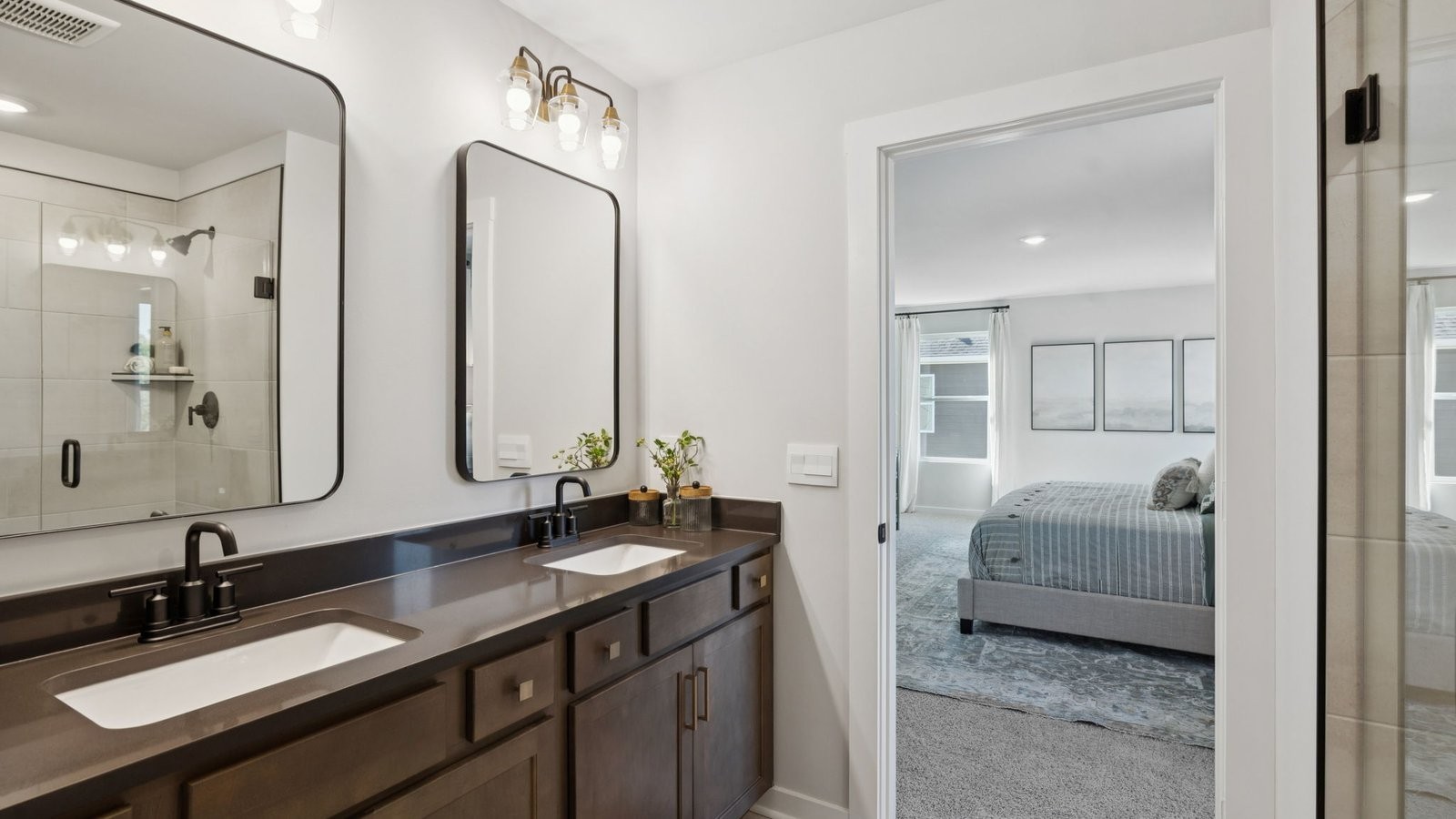 305 Harvest Point Boulevard Spring Hill, TN 37174 - Photo 37 of 48 a en suite bathroom with double vanity sinks and a mirror