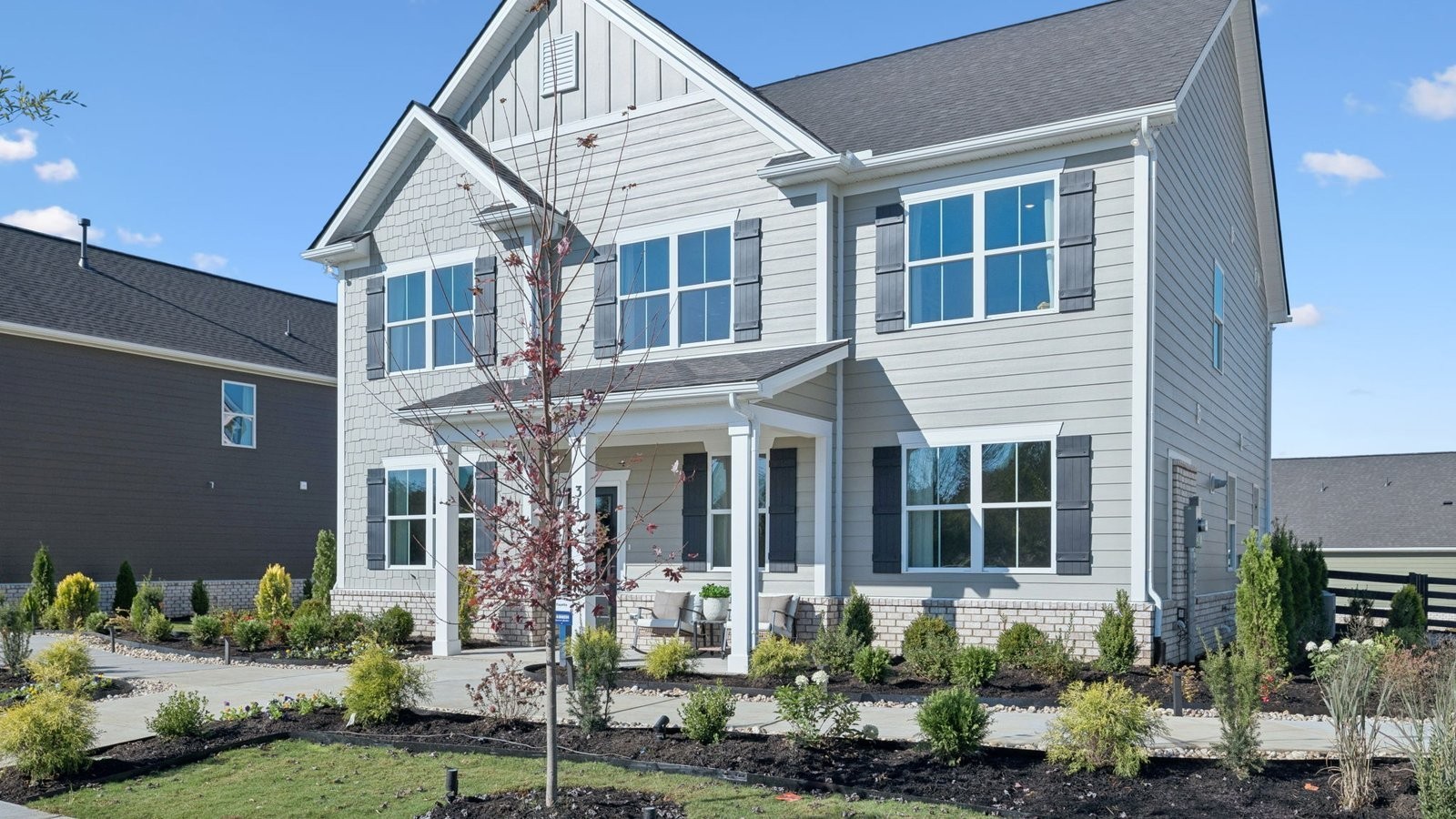 305 Harvest Point Boulevard Spring Hill, TN 37174 - Photo 5 of 48 a front view of a house with a yard