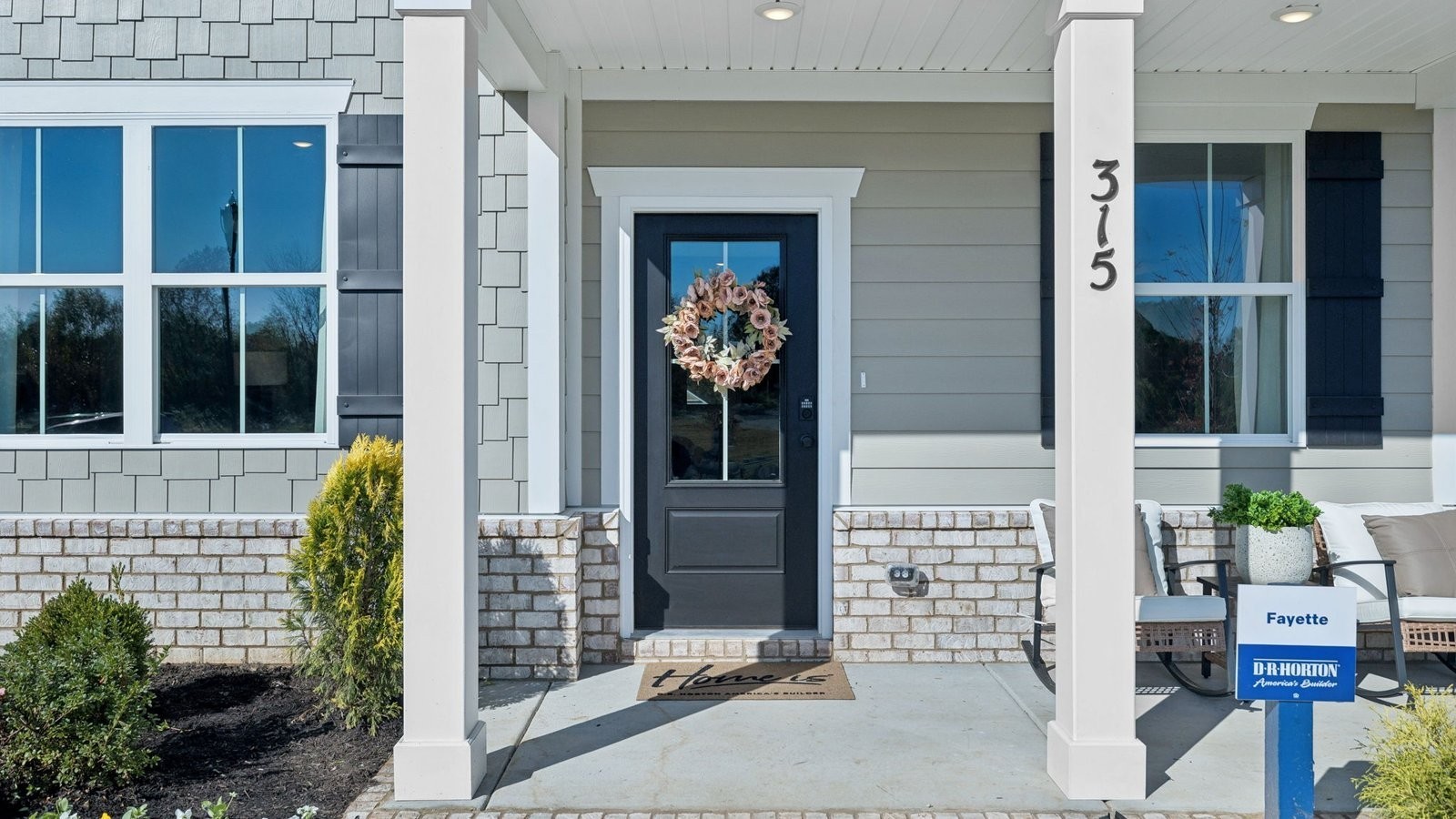 305 Harvest Point Boulevard Spring Hill, TN 37174 - Photo 7 of 48 a view of front door of house and living room